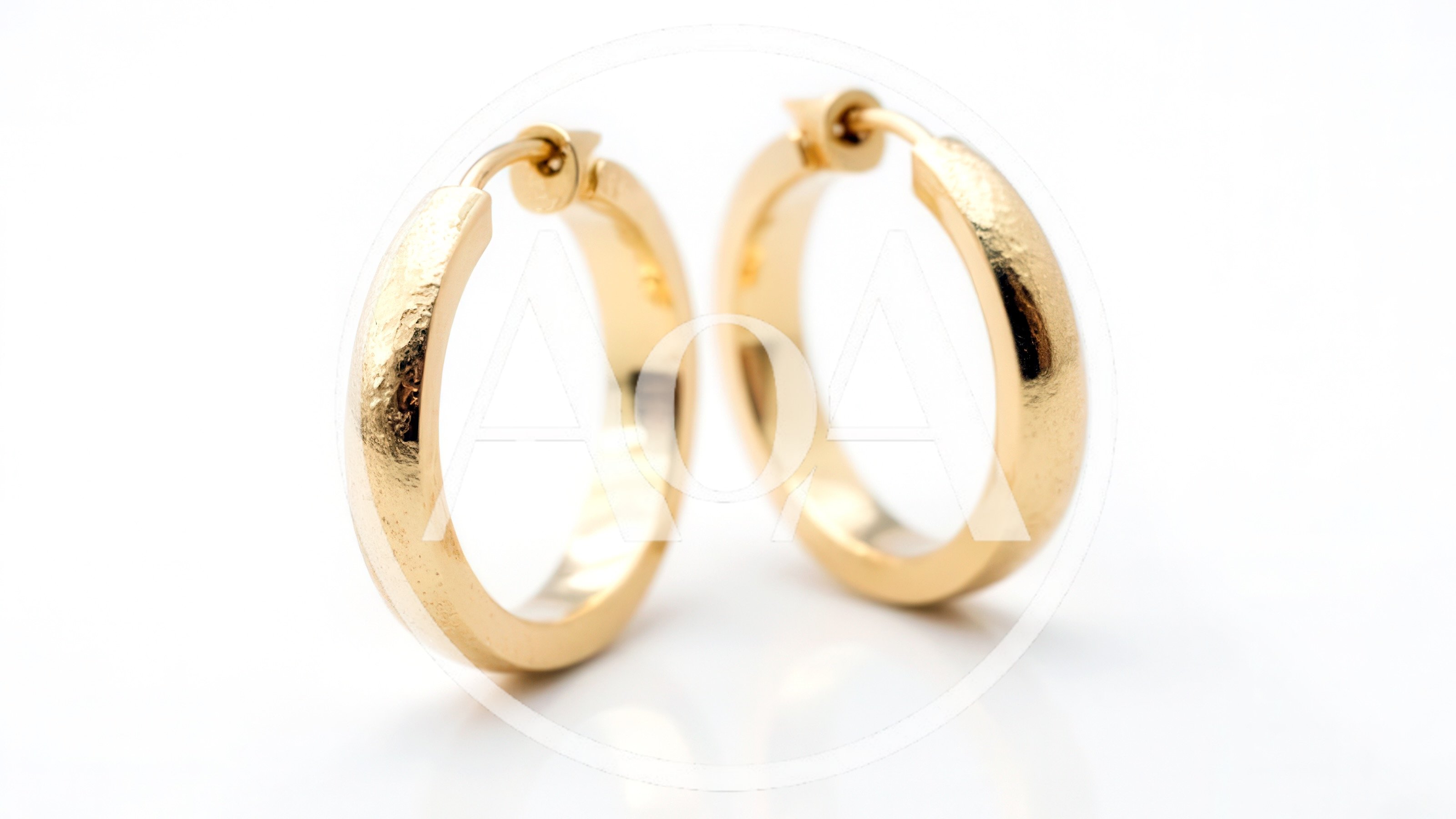 Pair Of Gold Hoop Earrings On White Background