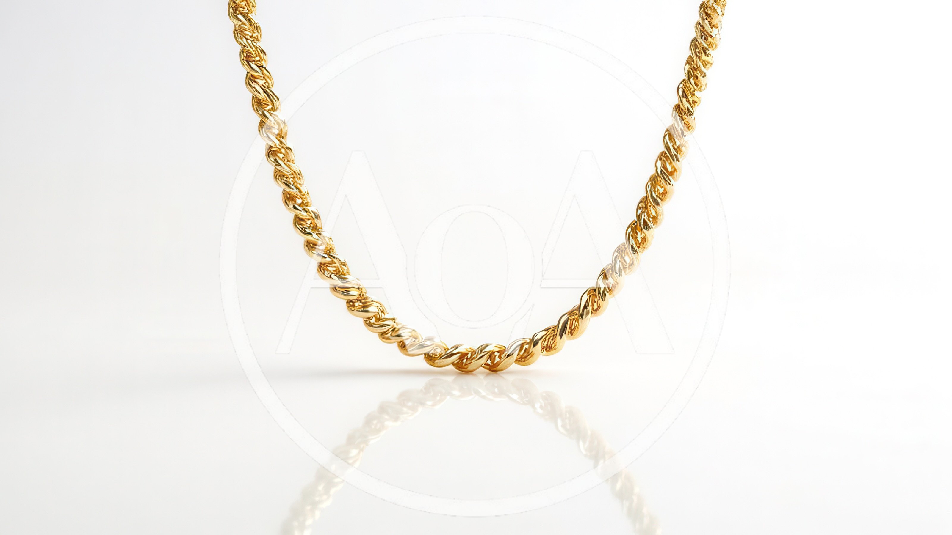 Gold Rope Chain Necklace On White Background