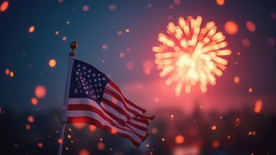 American Flag Waving Against Fireworks Display