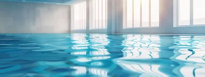 Calm Water Surface In A Bright Indoor Swimming Pool