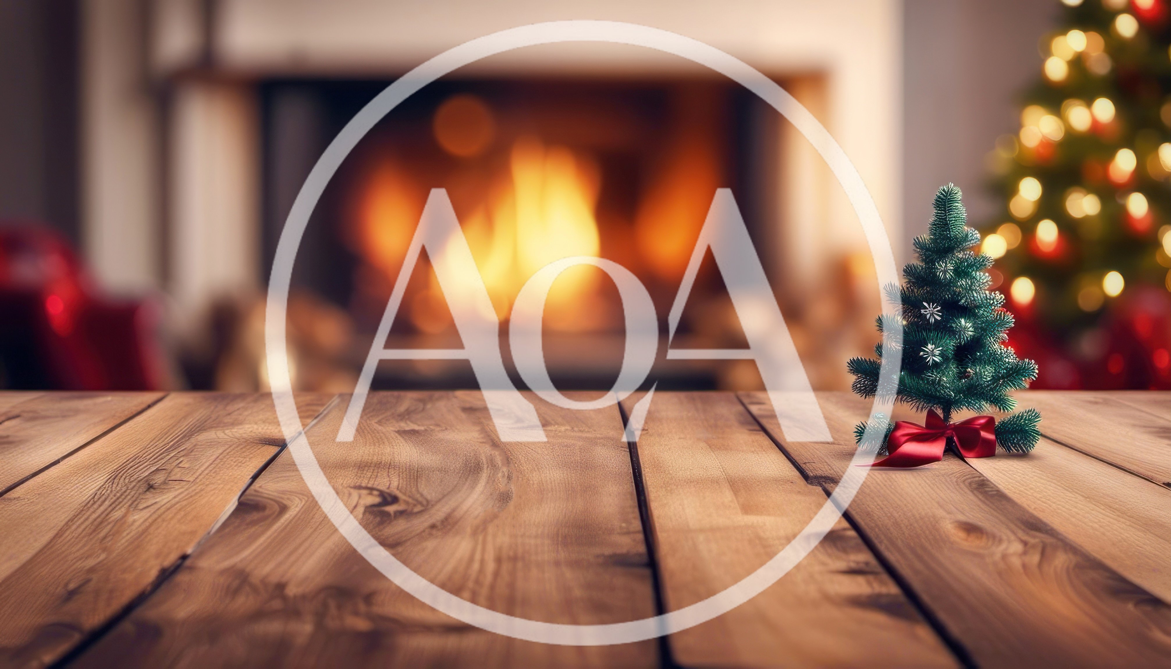 Small Christmas Tree on Wooden Table with Fireplace Background