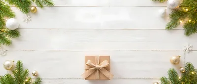 Christmas Gift Box on White Wooden Background