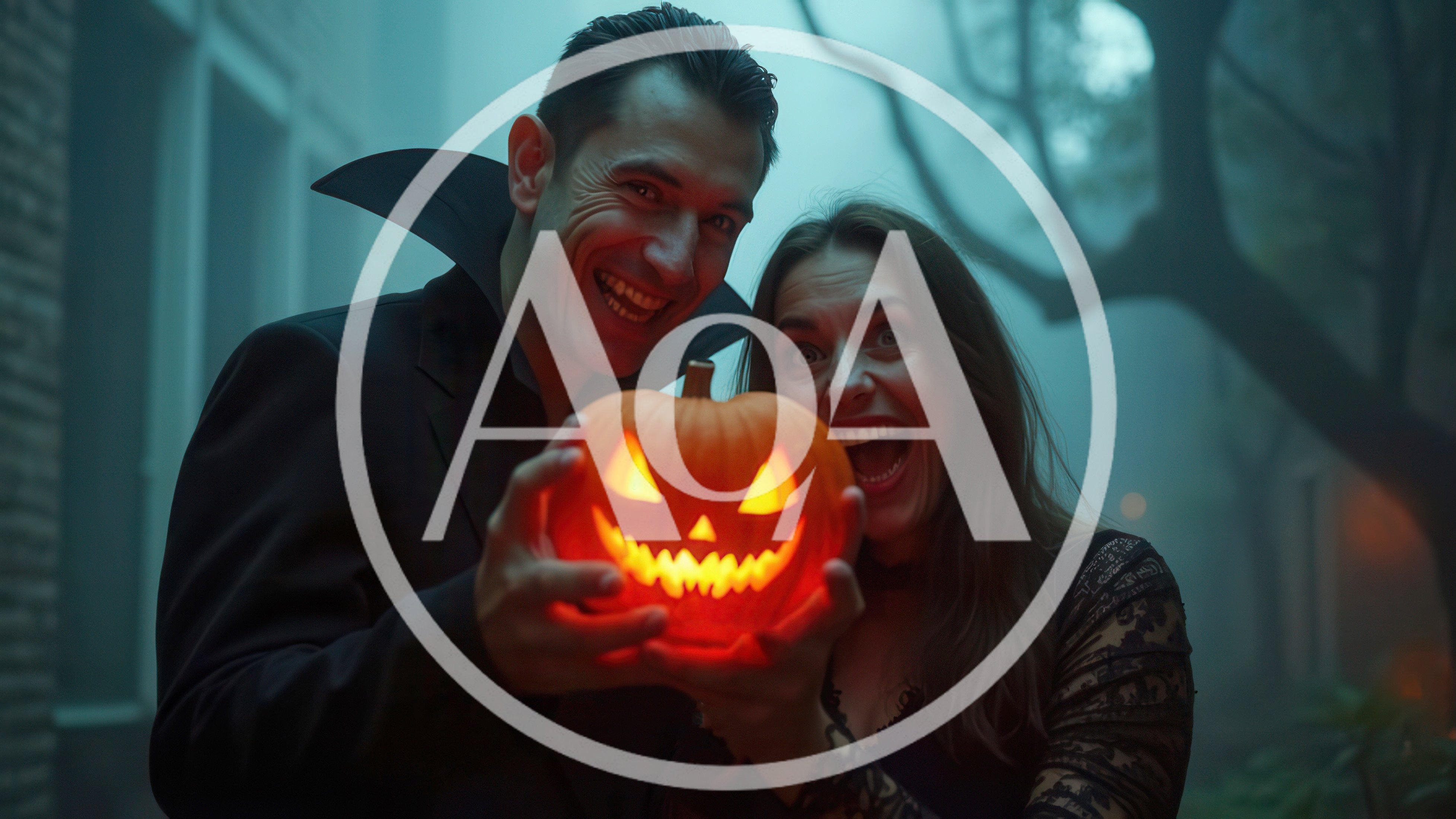 Couple Dressed As Vampires Holding A Glowing Jack O Lantern