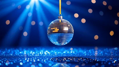 Shiny Disco Ball Rotating Above Glittering Blue Surface