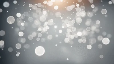 Abstract White Bokeh Particles Floating On Grey Background