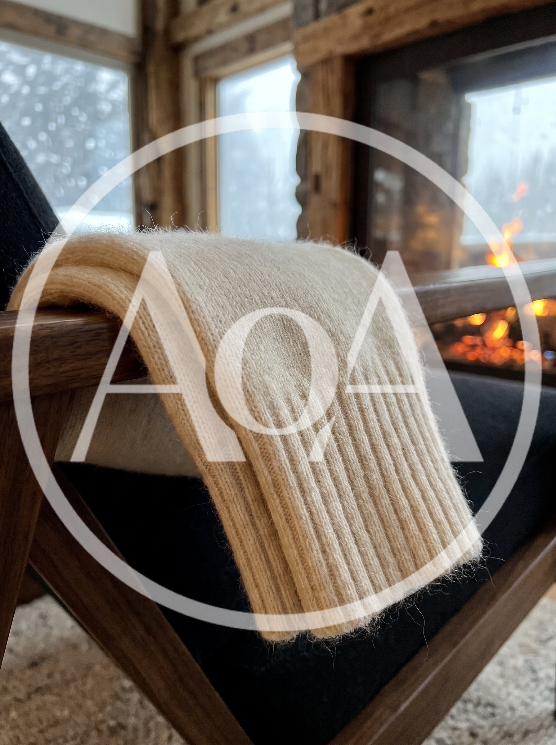 Cream Wool Throw Blanket Draped Over Wooden Chair