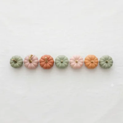 Row Of Pastel Colored Decorative Pumpkins