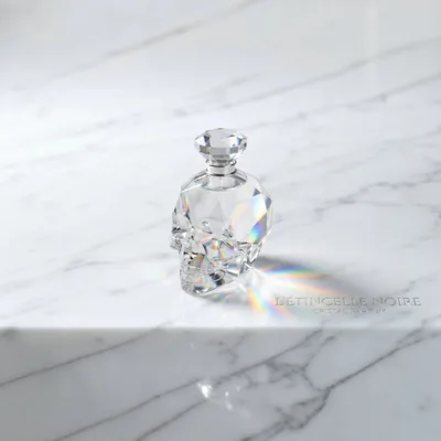 Crystal Skull Perfume Bottle on White Marble
