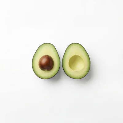 Two Halves Of A Fresh Ripe Avocado