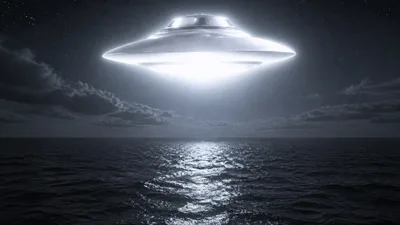 disc-shaped UFO alien spaceship flying over Pacific Ocean at night