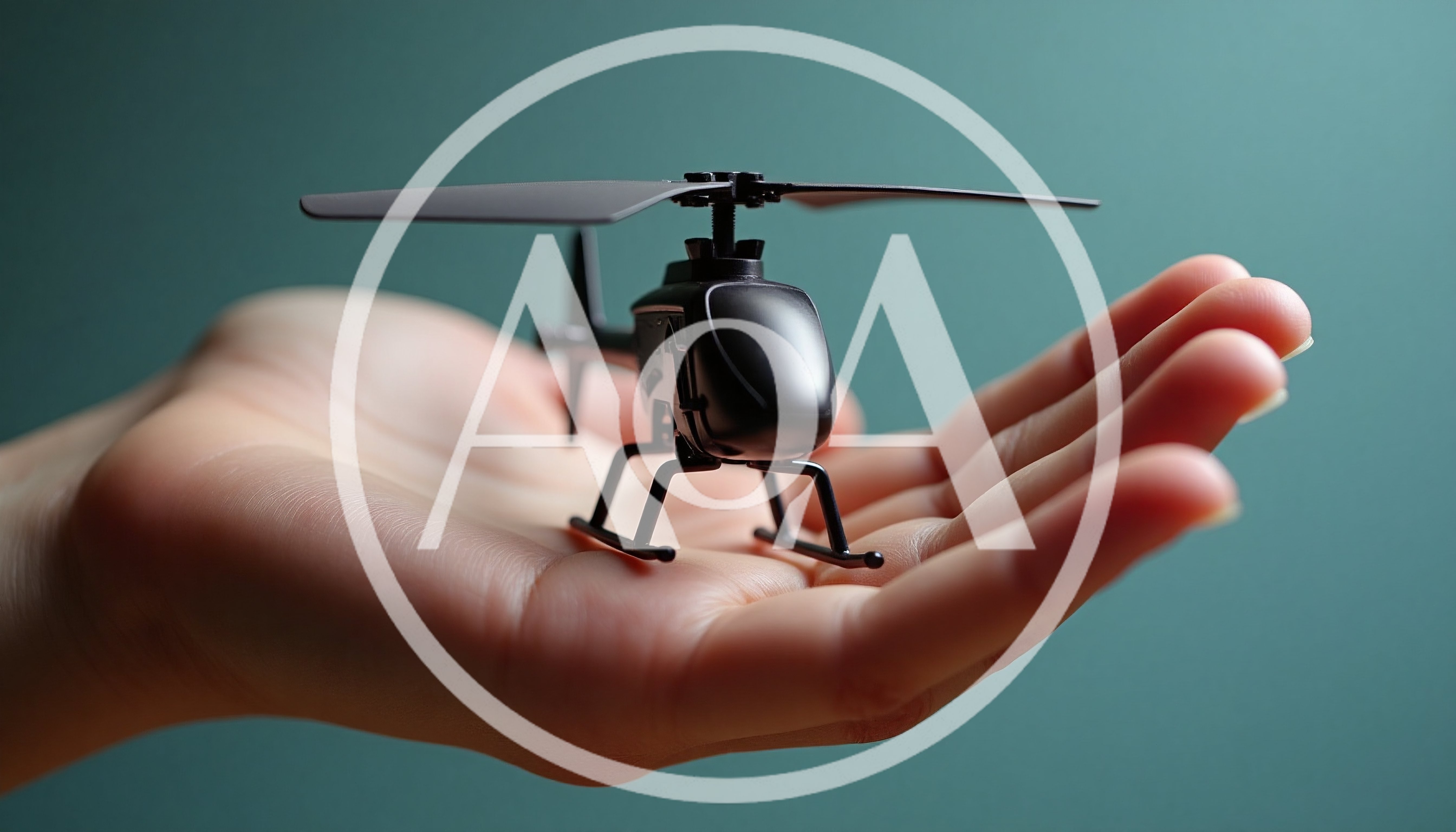 Small Toy Helicopter Held In Human Hand