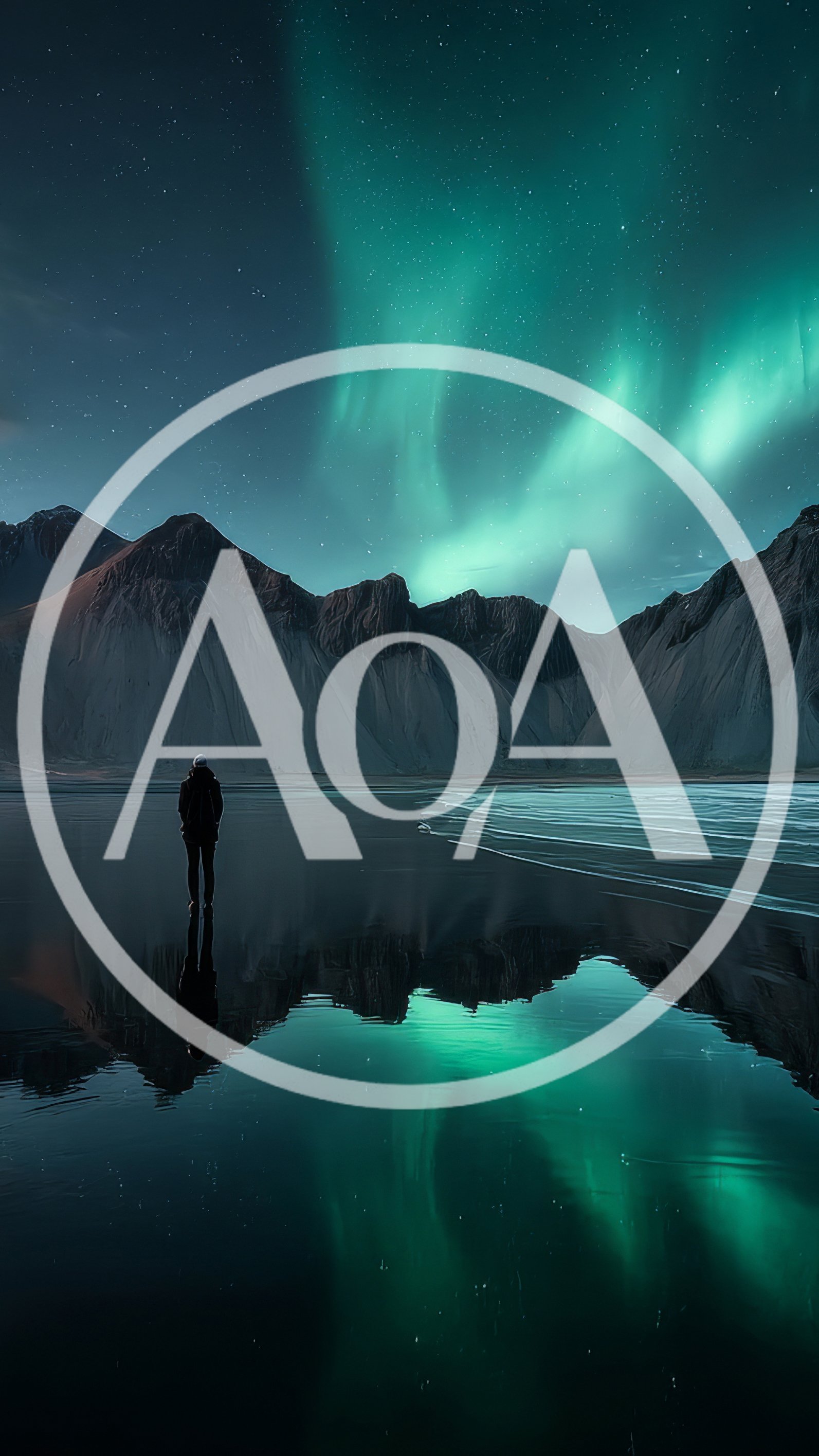 Lone Person Standing Before Aurora Borealis Over Mountains