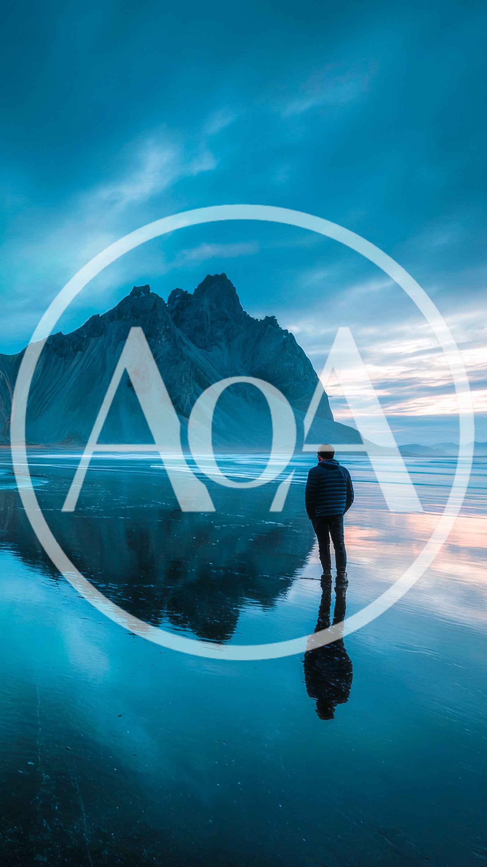 Man Standing On Vestrahorn Beach At Sunset