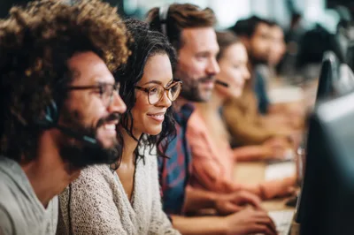 Diverse Customer Support Team Working In Modern Office