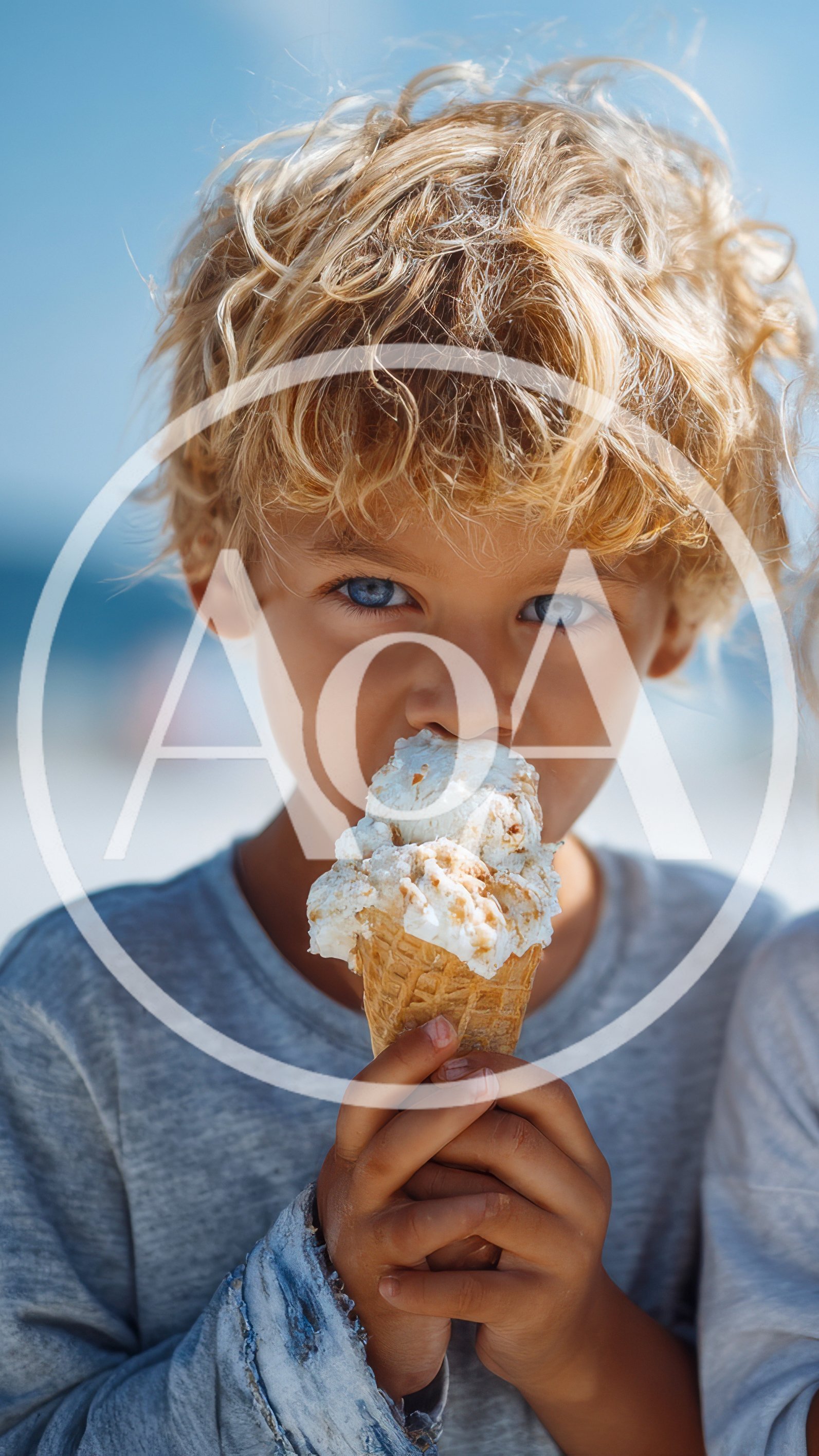 Young Boy Eating Ice Cream Cone on Beach