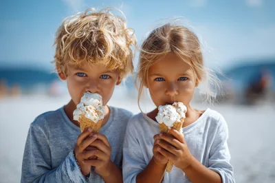 Young Children Eating Ice Cream Cones on Beach
