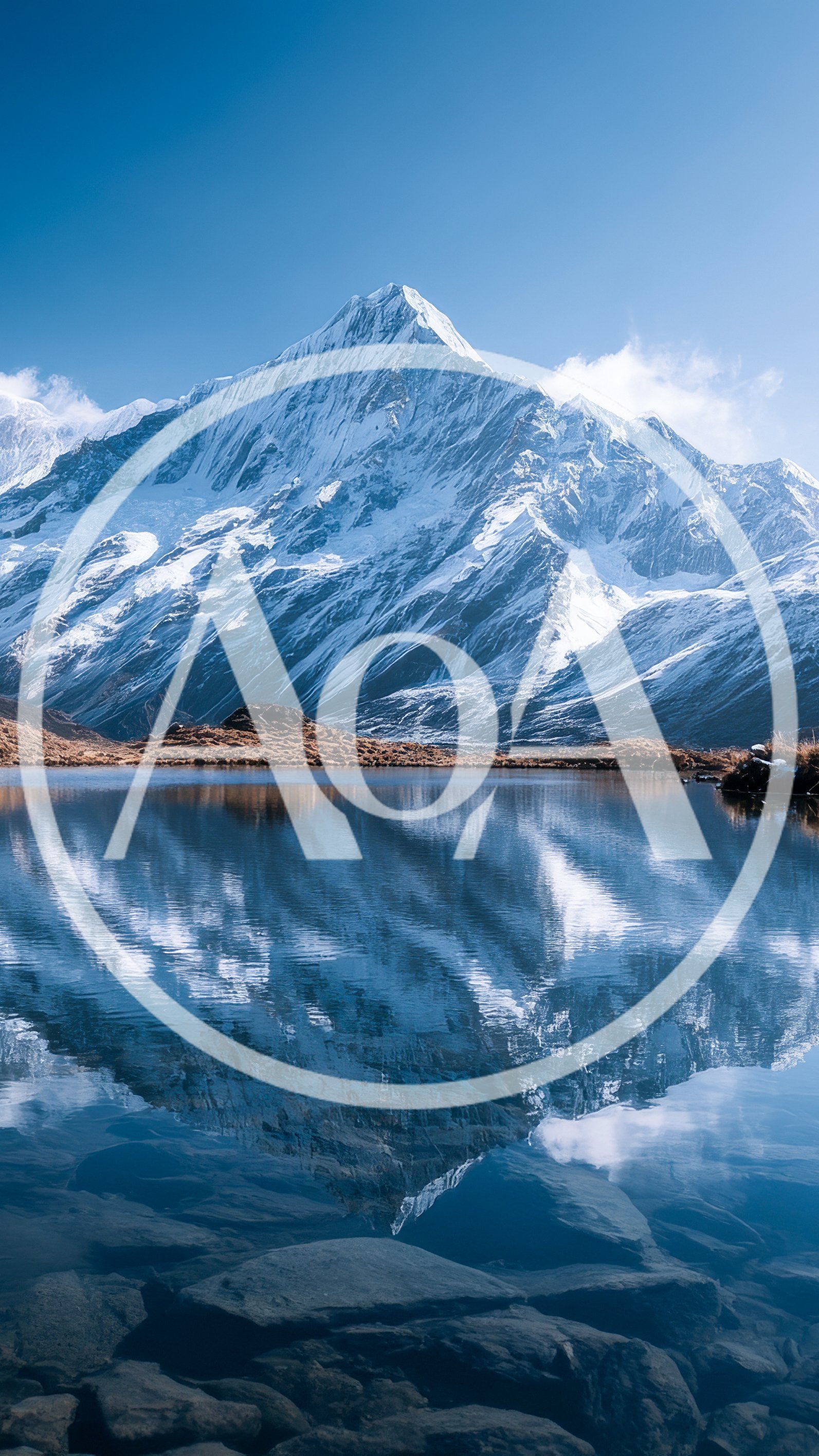 Snow Capped Mountain Peak Reflected In Alpine Lake