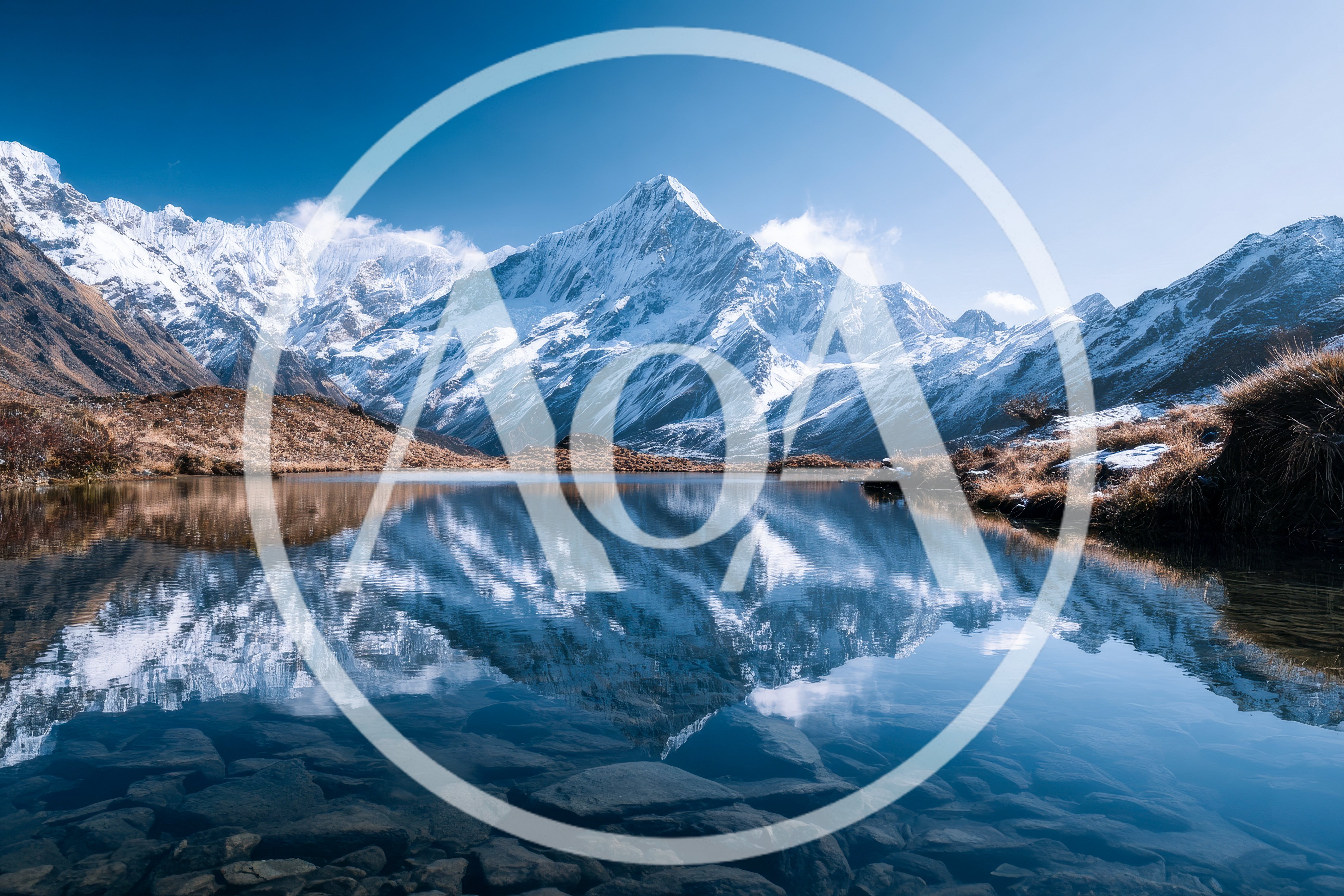 Snow Capped Mountain Peaks Reflected In Alpine Lake