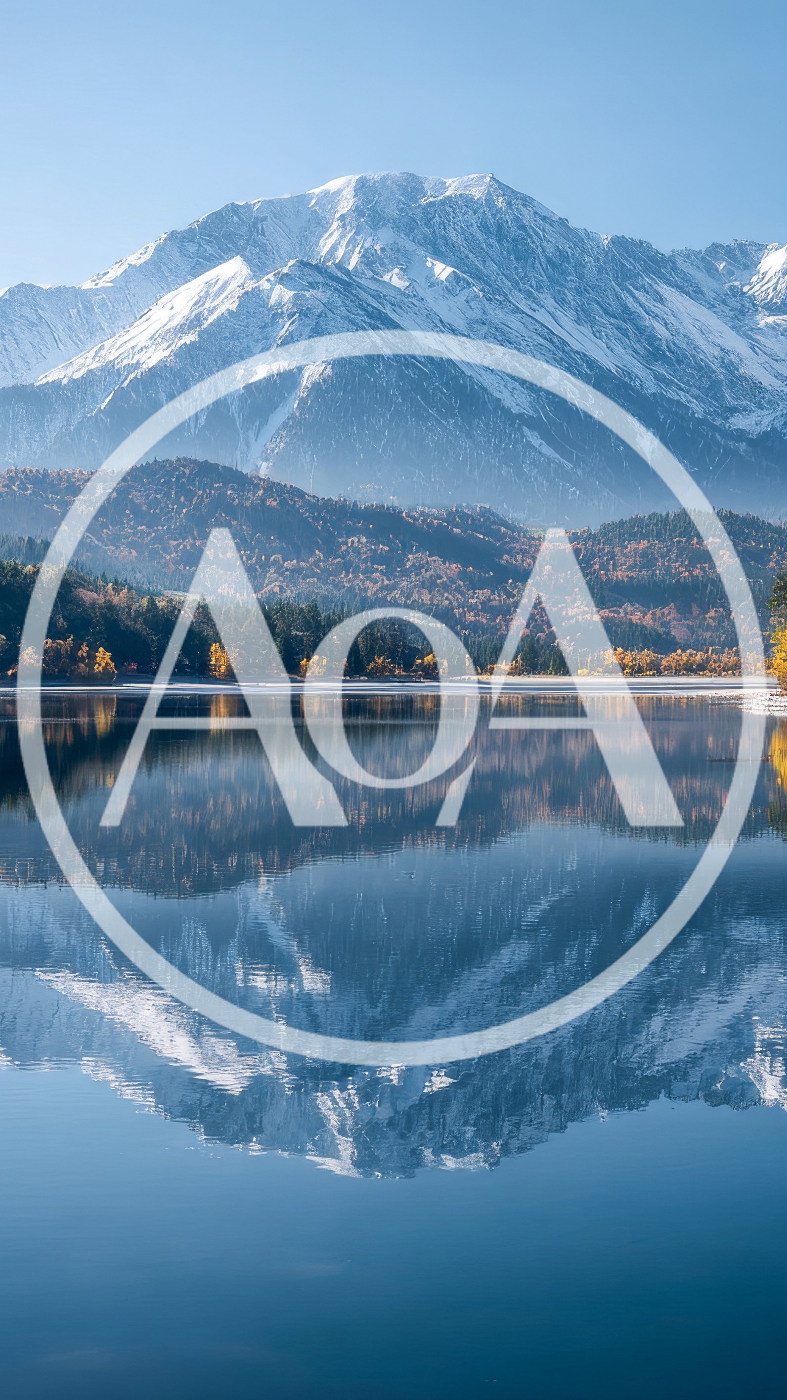Snow Capped Mountain Reflected In A Calm Lake