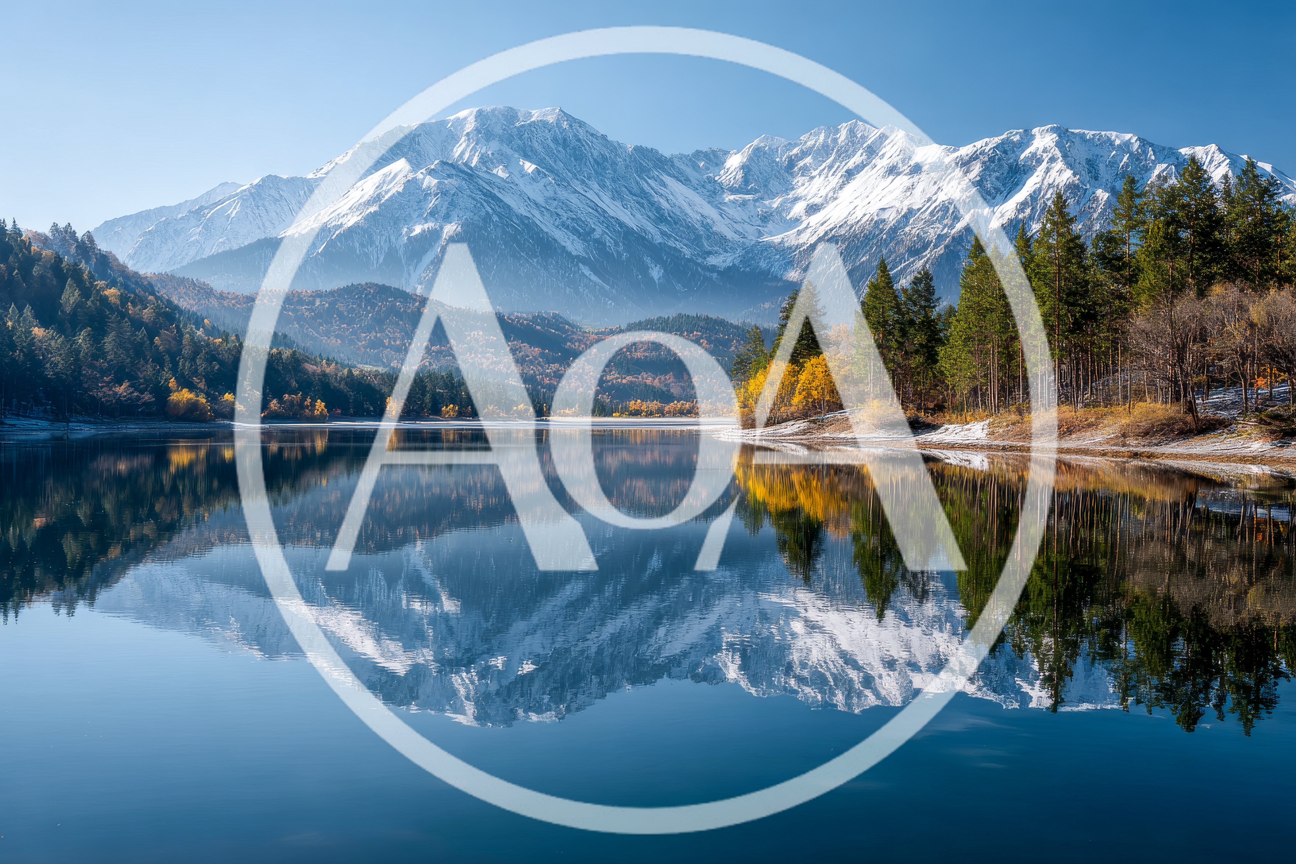 Snow Capped Mountain Range Reflecting In Calm Lake