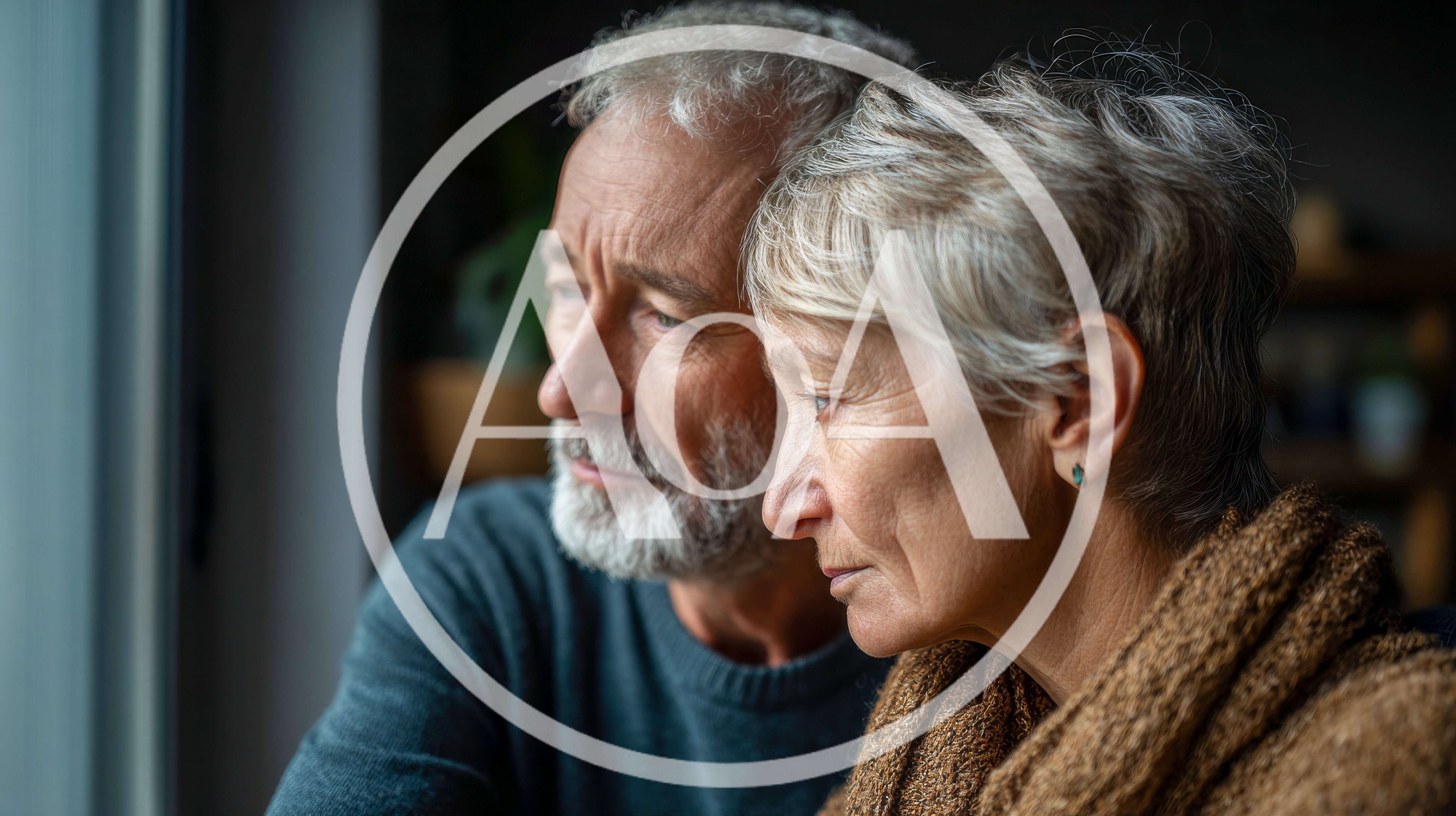 Senior Couple Looking Out A Window Together