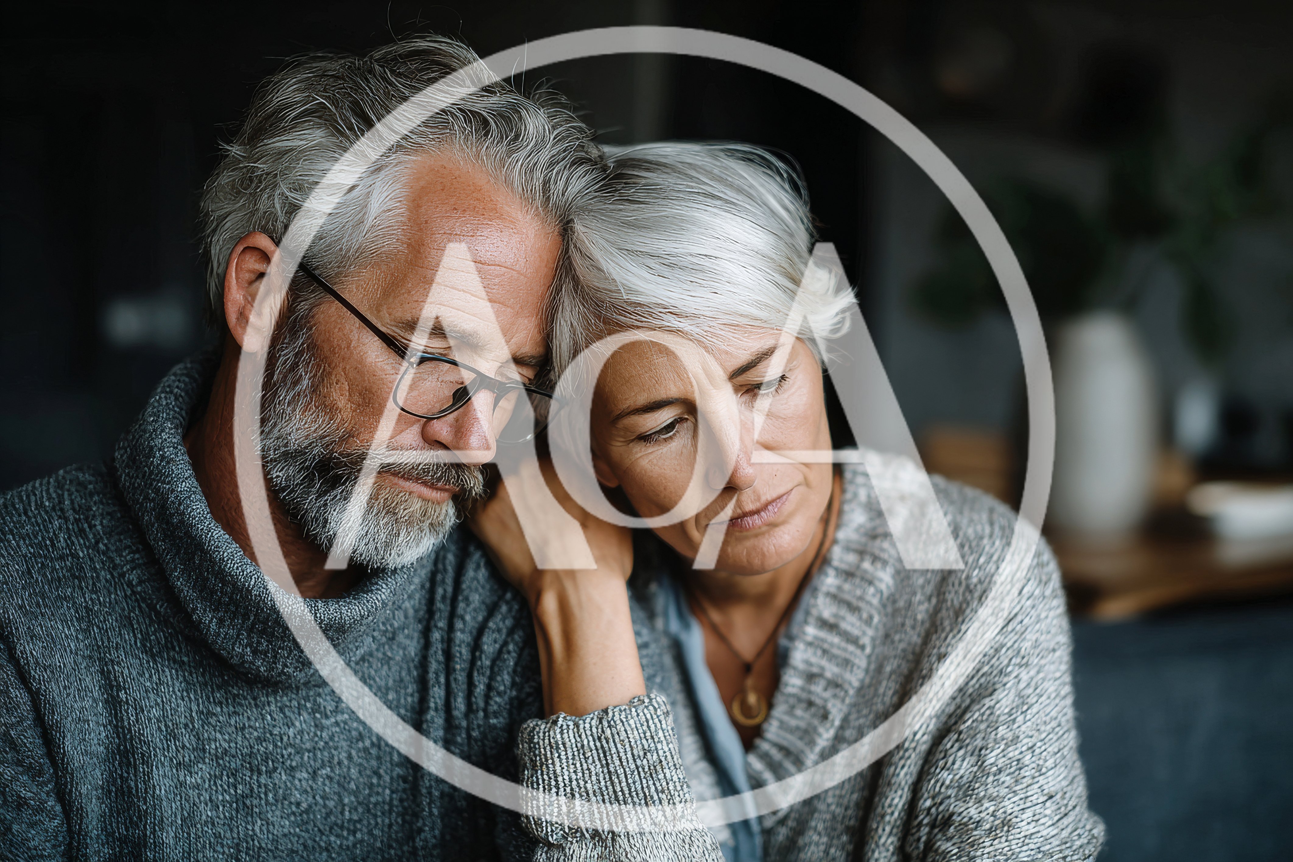 Sad Senior Couple Leaning On Each Other