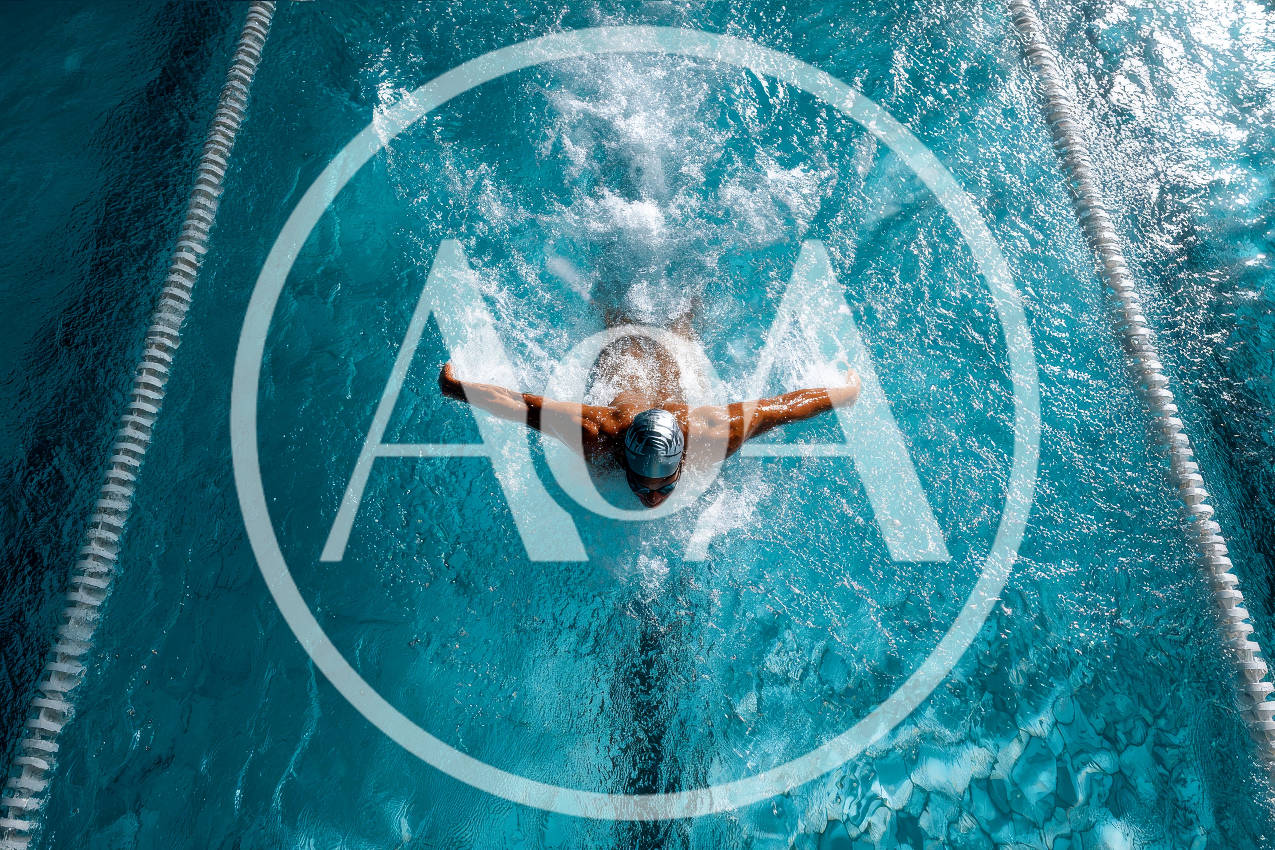 Swimmer Performing Butterfly Stroke in Pool