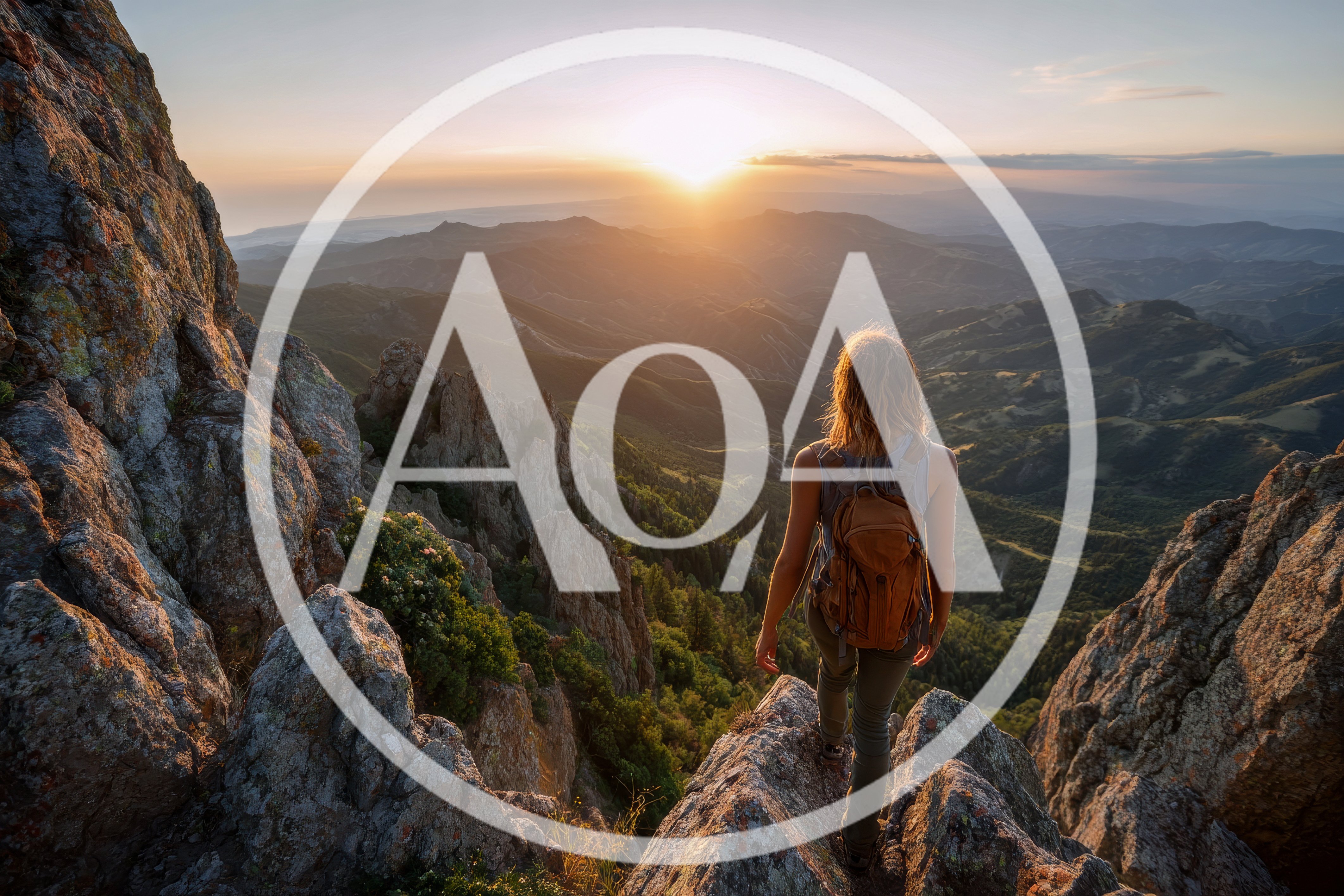 Hiker Standing On Mountain Peak At Sunset
