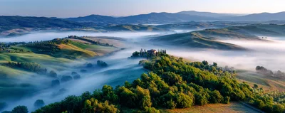 Aerial View Of Misty Tuscan Landscape At Sunrise