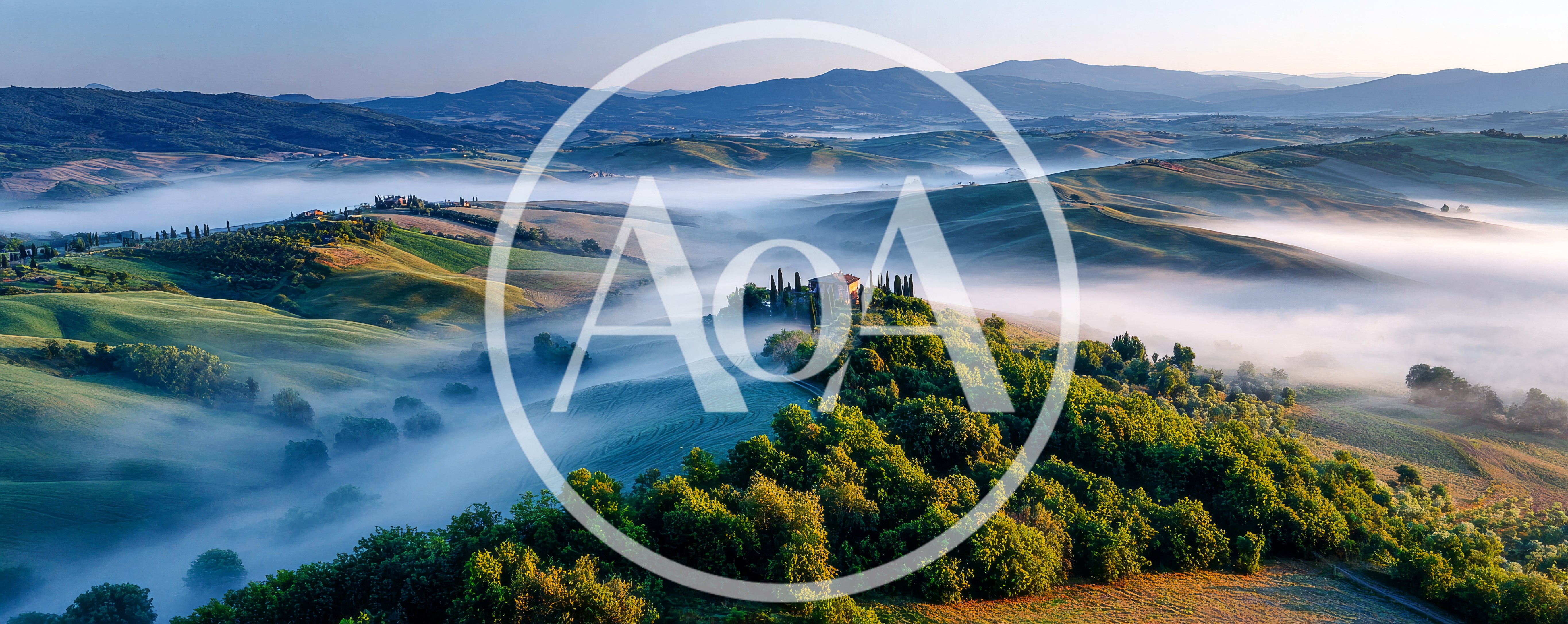 Aerial View Of Misty Tuscan Landscape At Sunrise