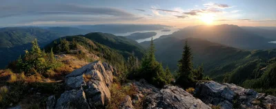 Panoramic Sunset View Over Mountain Peaks And Fjord