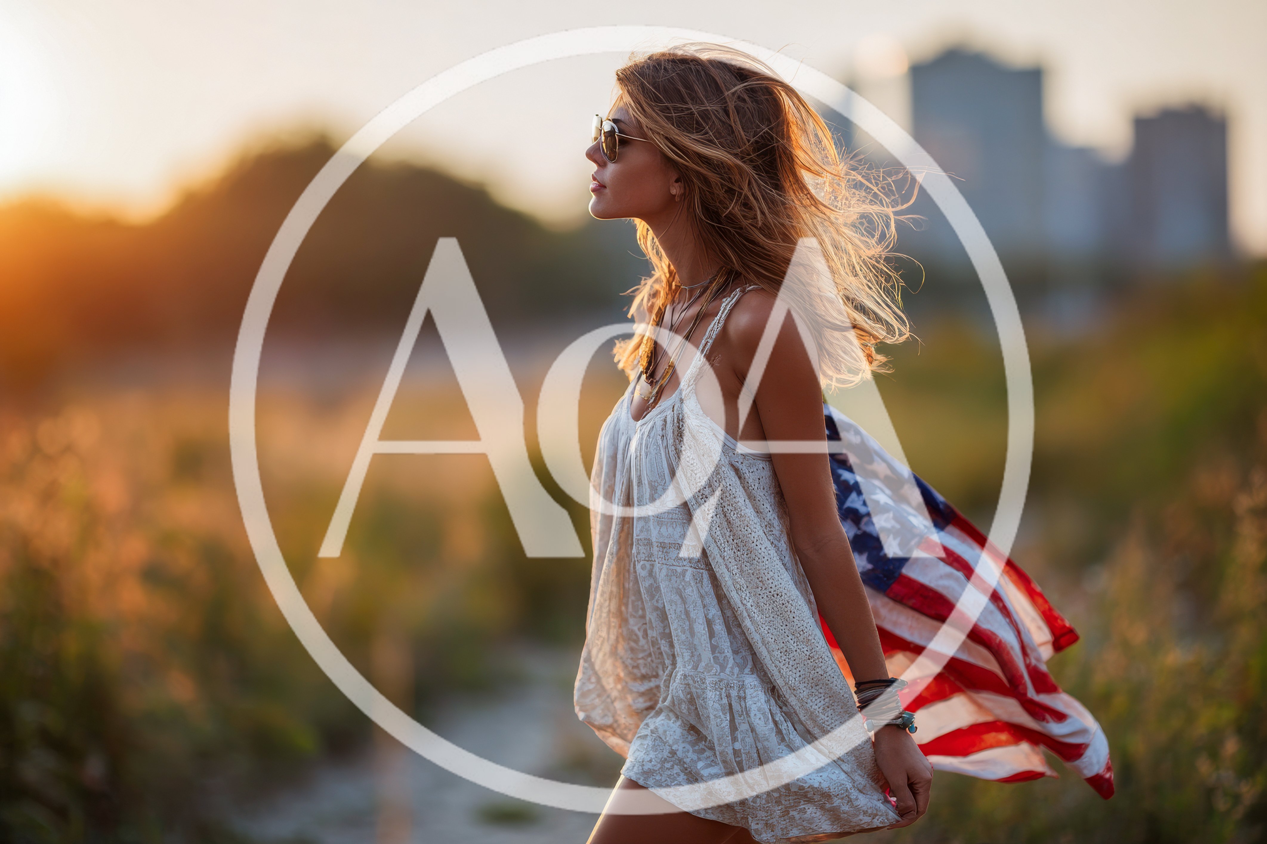 Young Woman Walking With American Flag At Sunset