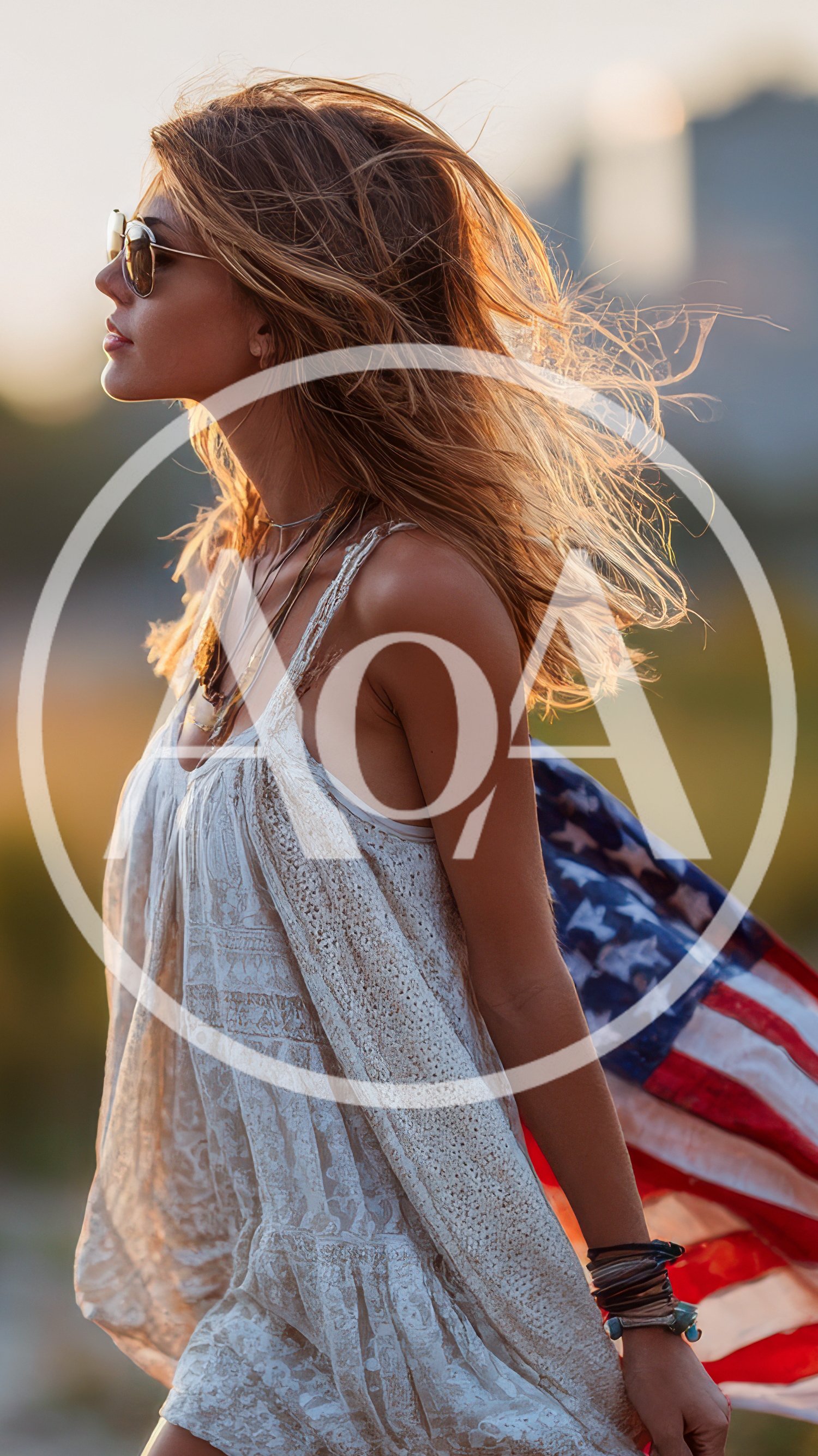 Young Woman Walking With American Flag At Sunset