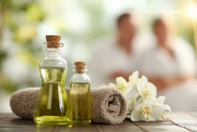 Spa Treatment Oil Bottles With Towel And Orchids