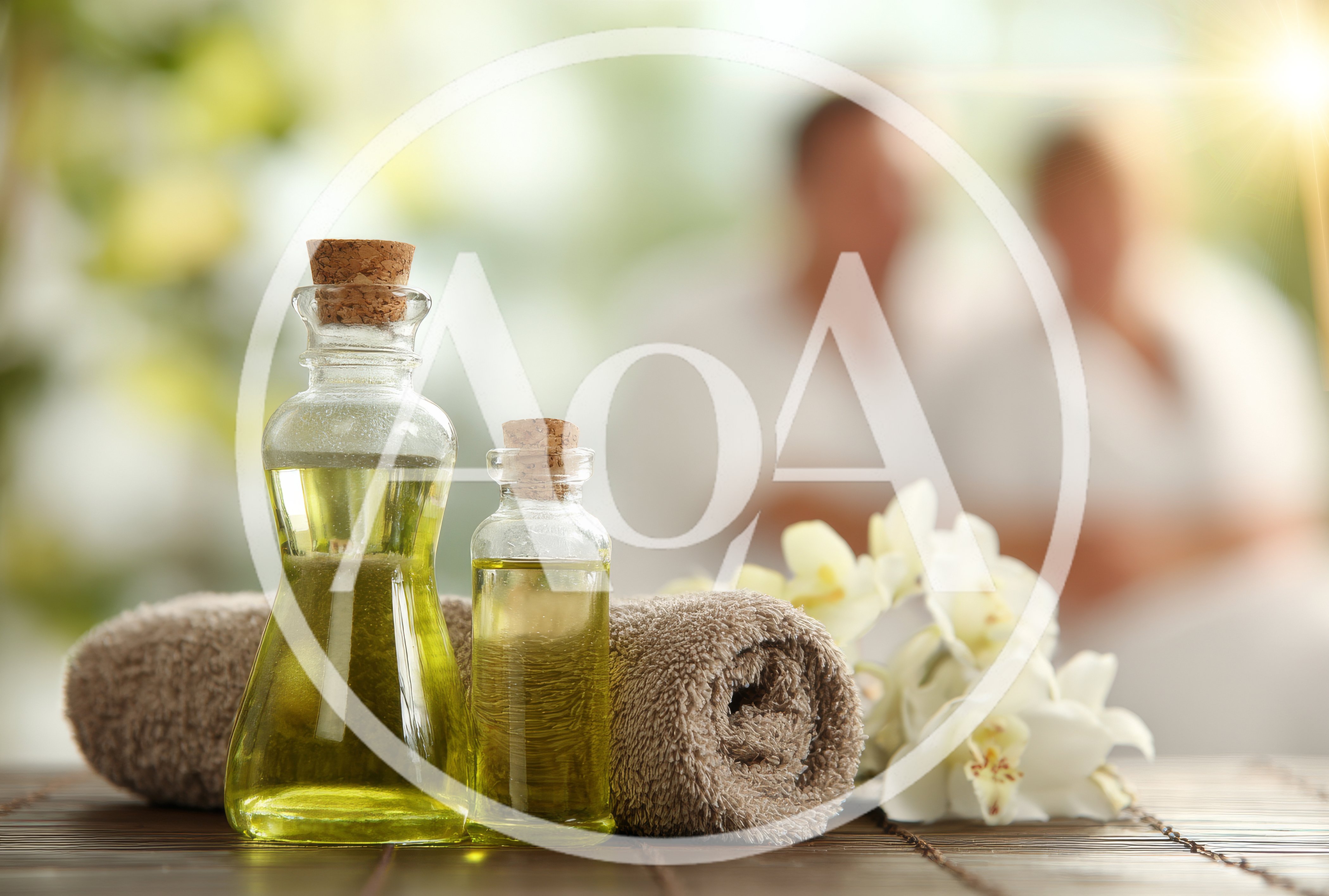 Spa Treatment Oil Bottles With Towel And Orchids