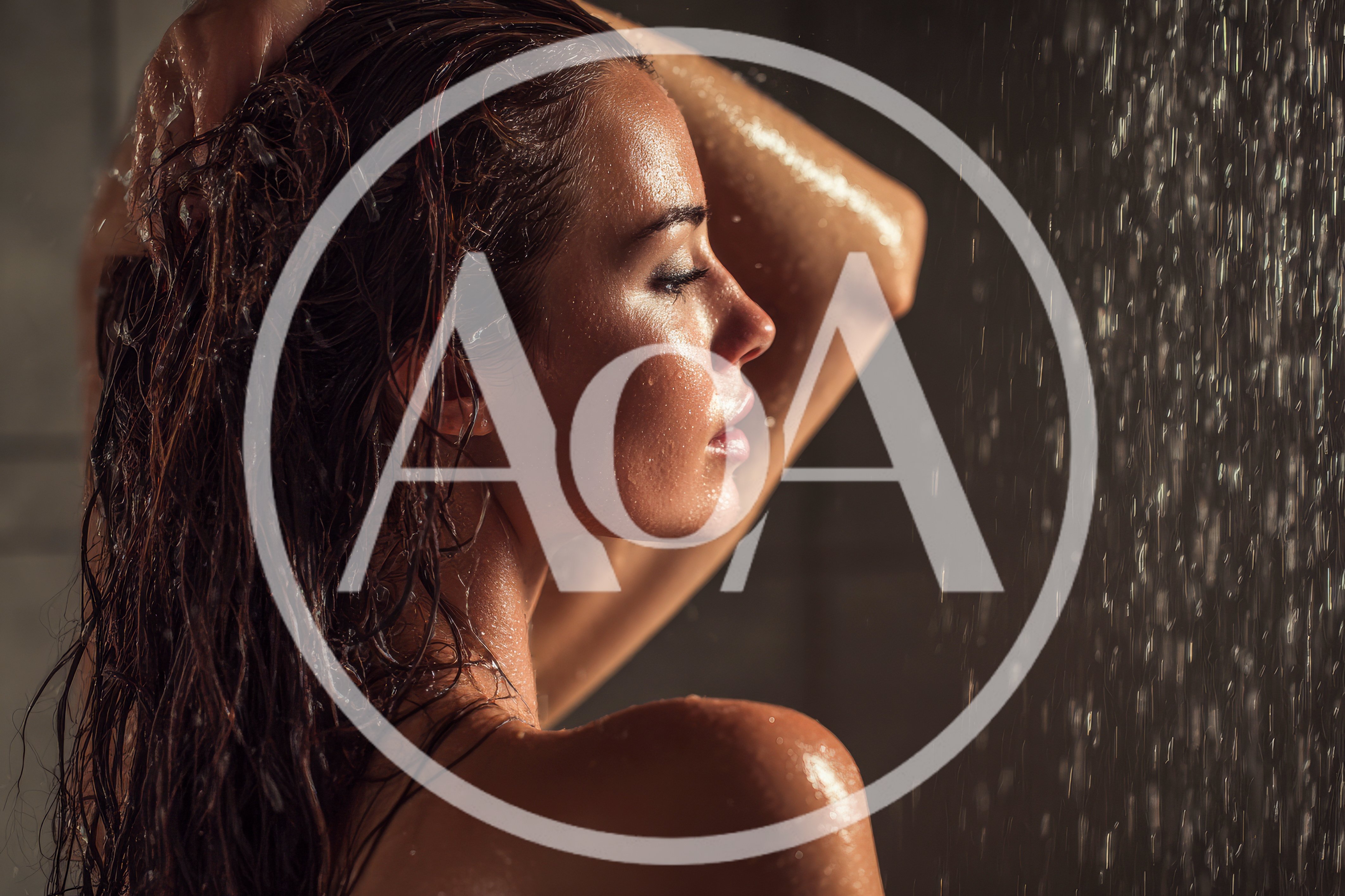 Woman Washing Her Hair Under A Shower