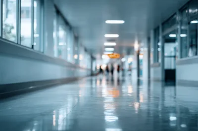 Blurred Hospital Corridor With People Walking