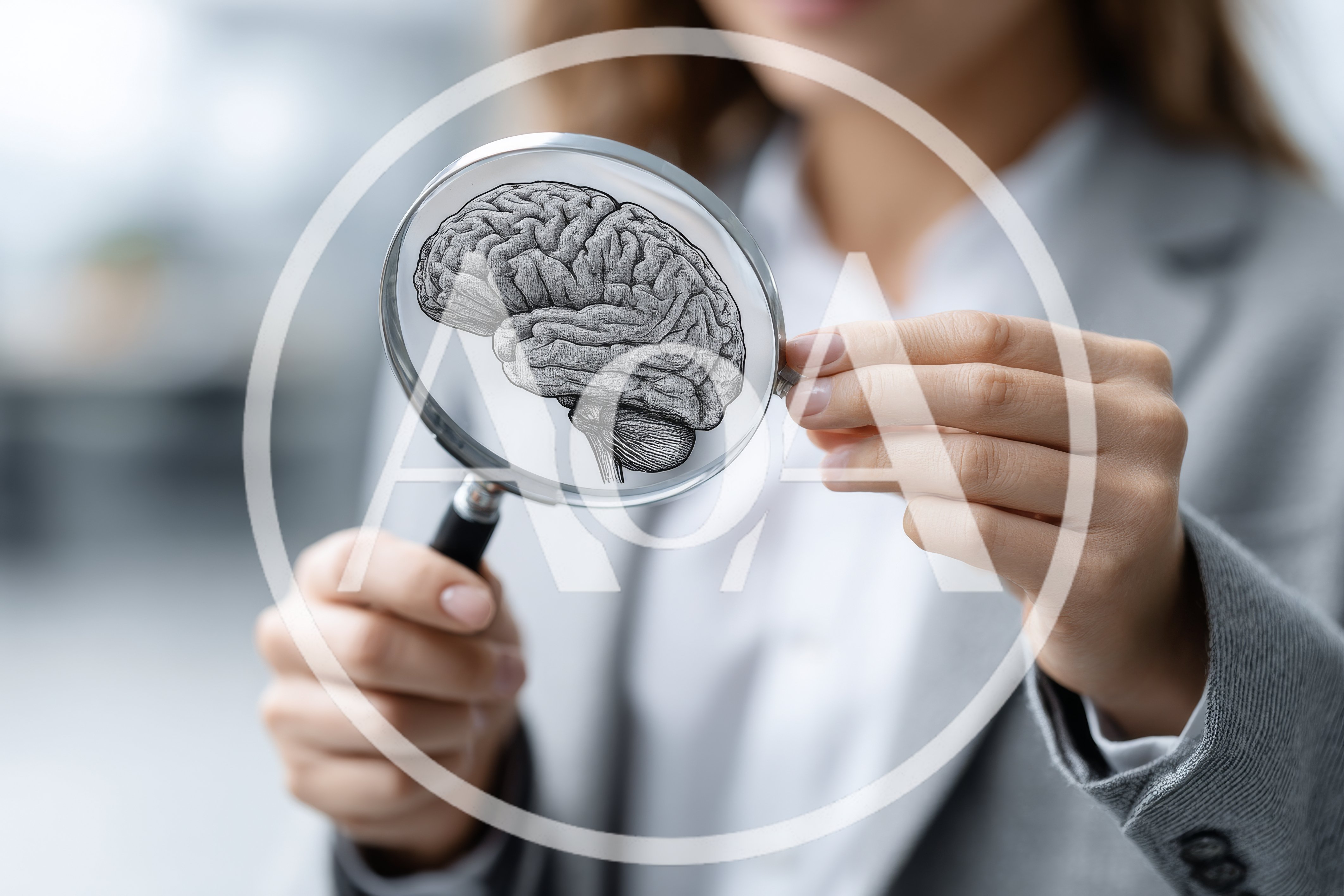 Businesswoman Examining A Human Brain Illustration Through Magnifying Glass
