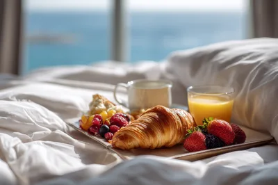 Breakfast Tray With Croissant And Fruit In Bed
