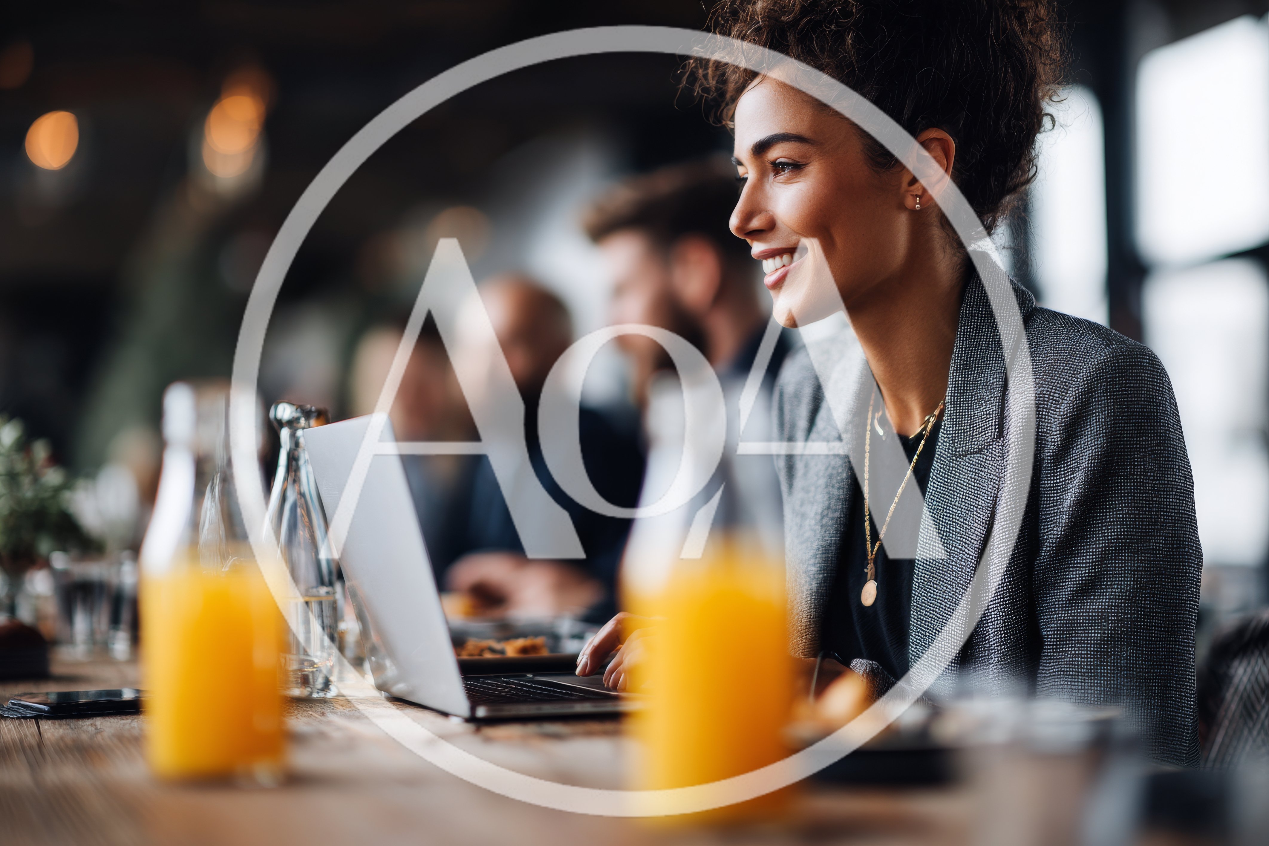 Professional Woman Working On Laptop In A Cafe