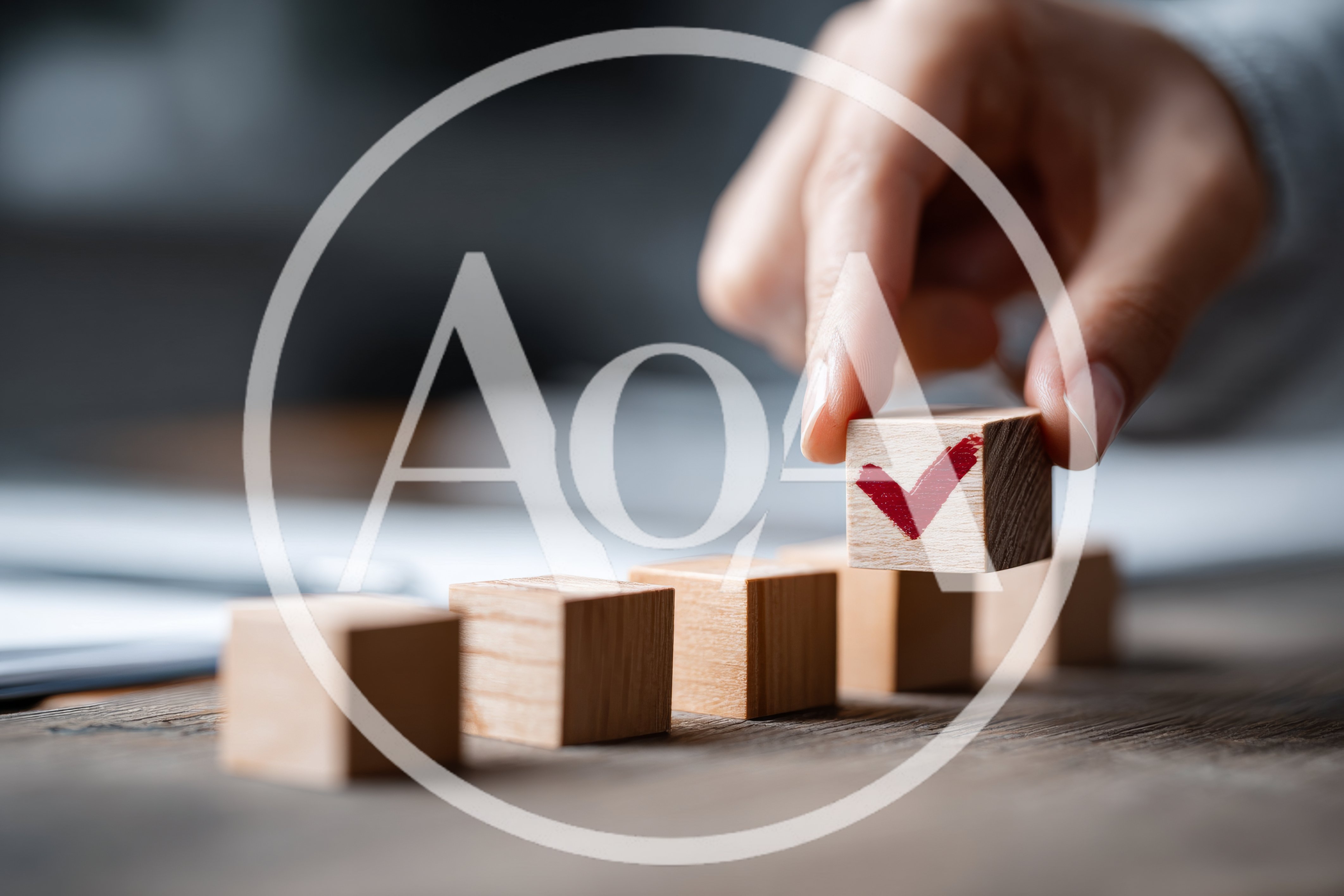 Hand Placing Wooden Block With Red Checkmark