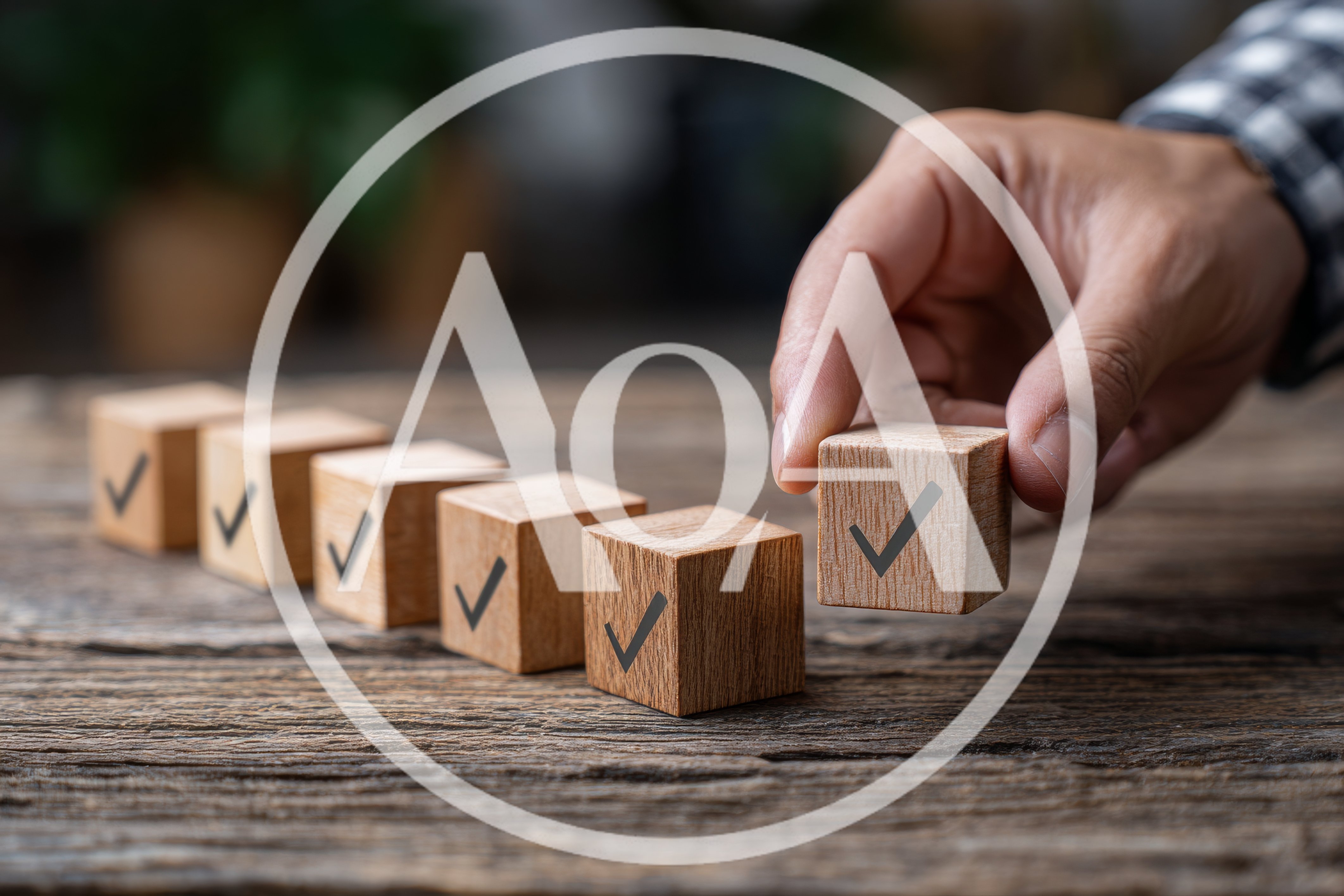 Hand Placing Wooden Block With Checkmark Symbol