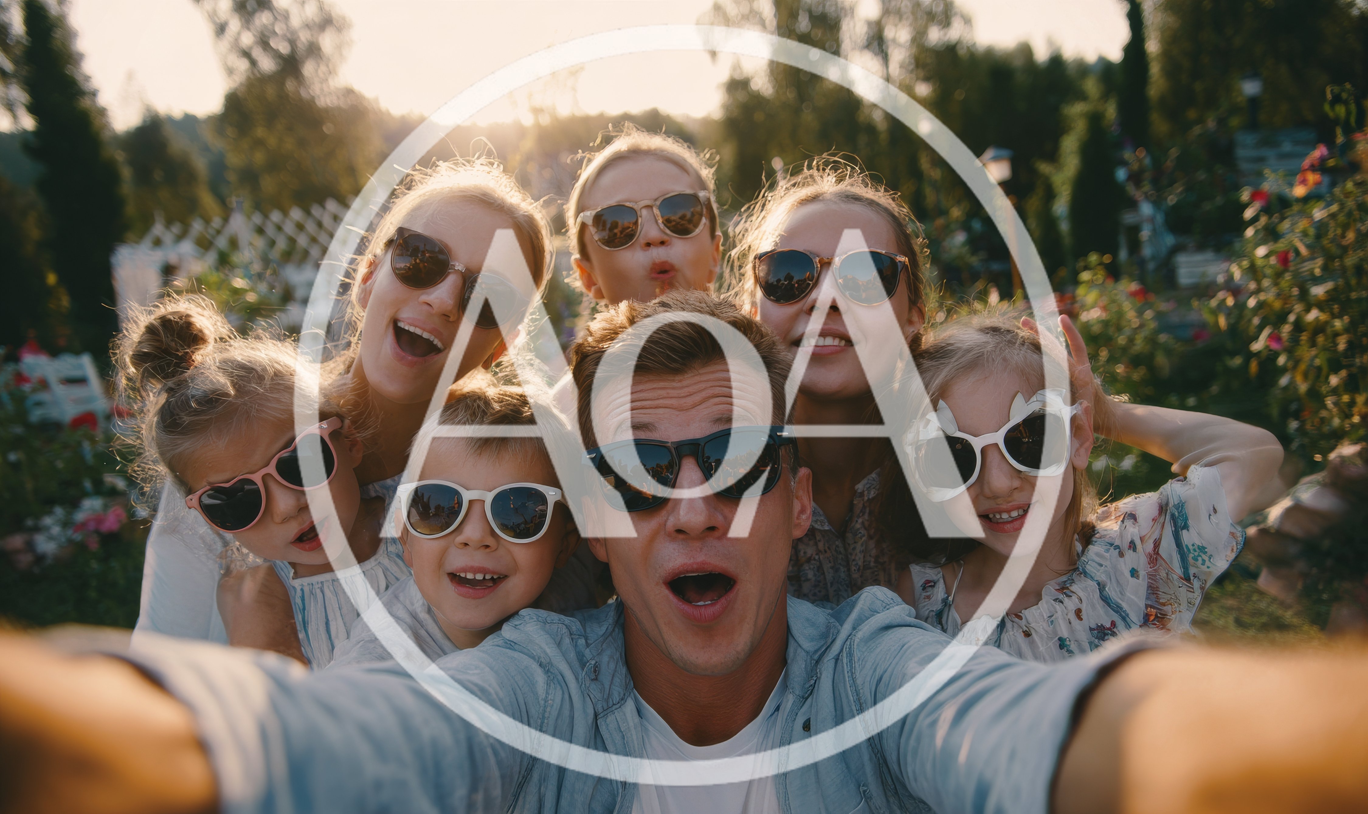 Family Taking A Fun Selfie In A Sunny Garden