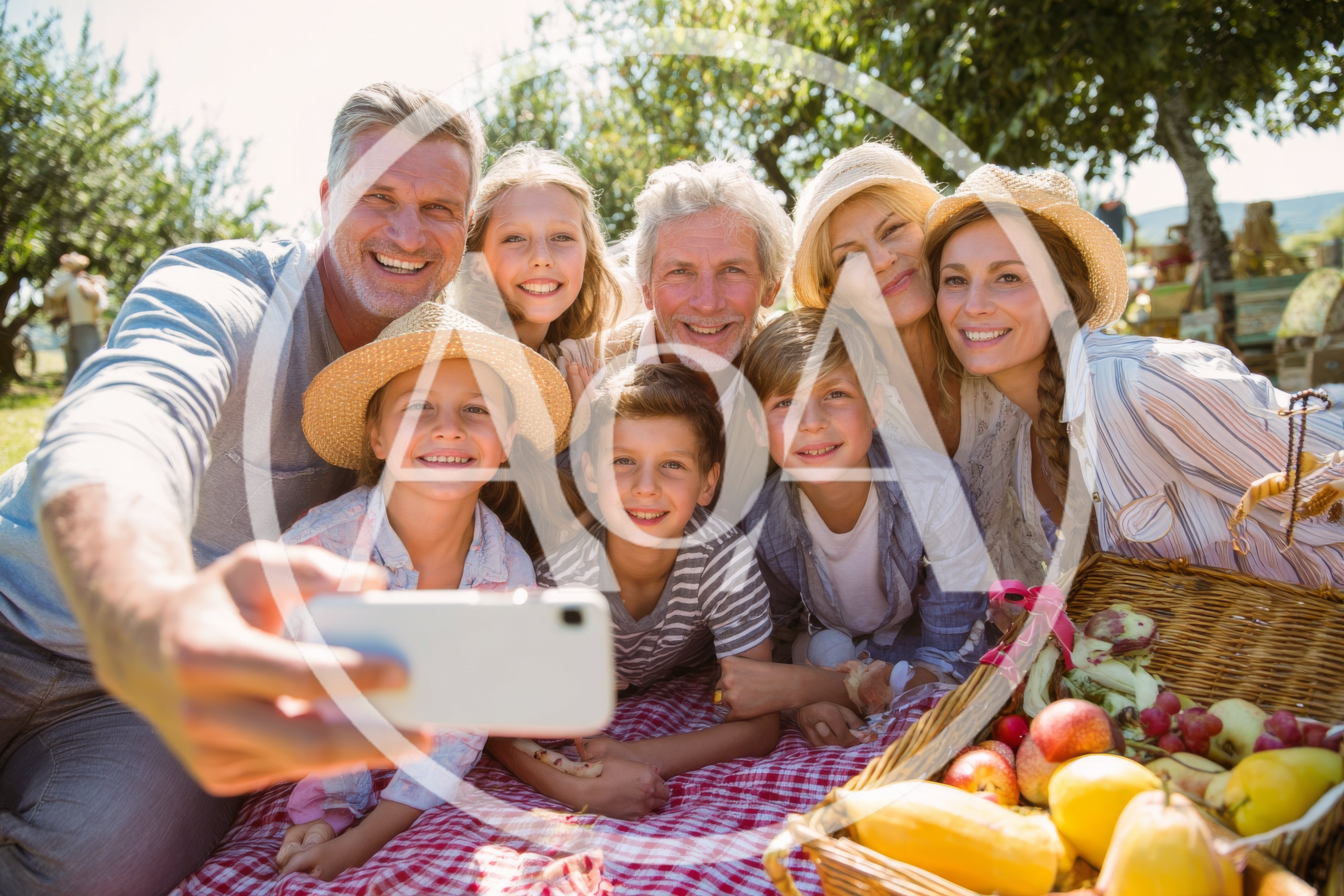 Multi-Generational Family Taking A Selfie At A Picnic