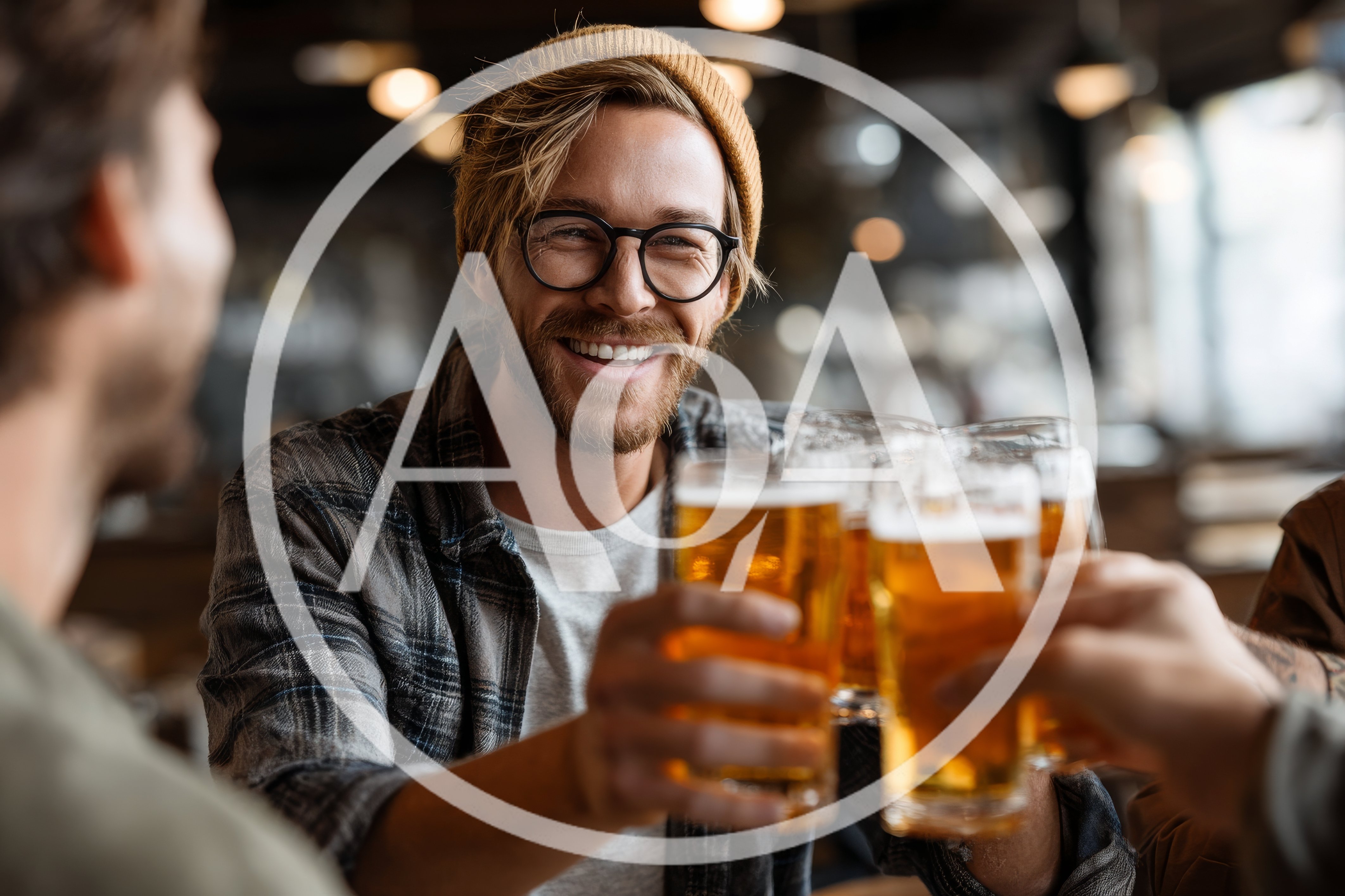 Friends Toasting With Beer Glasses In A Pub