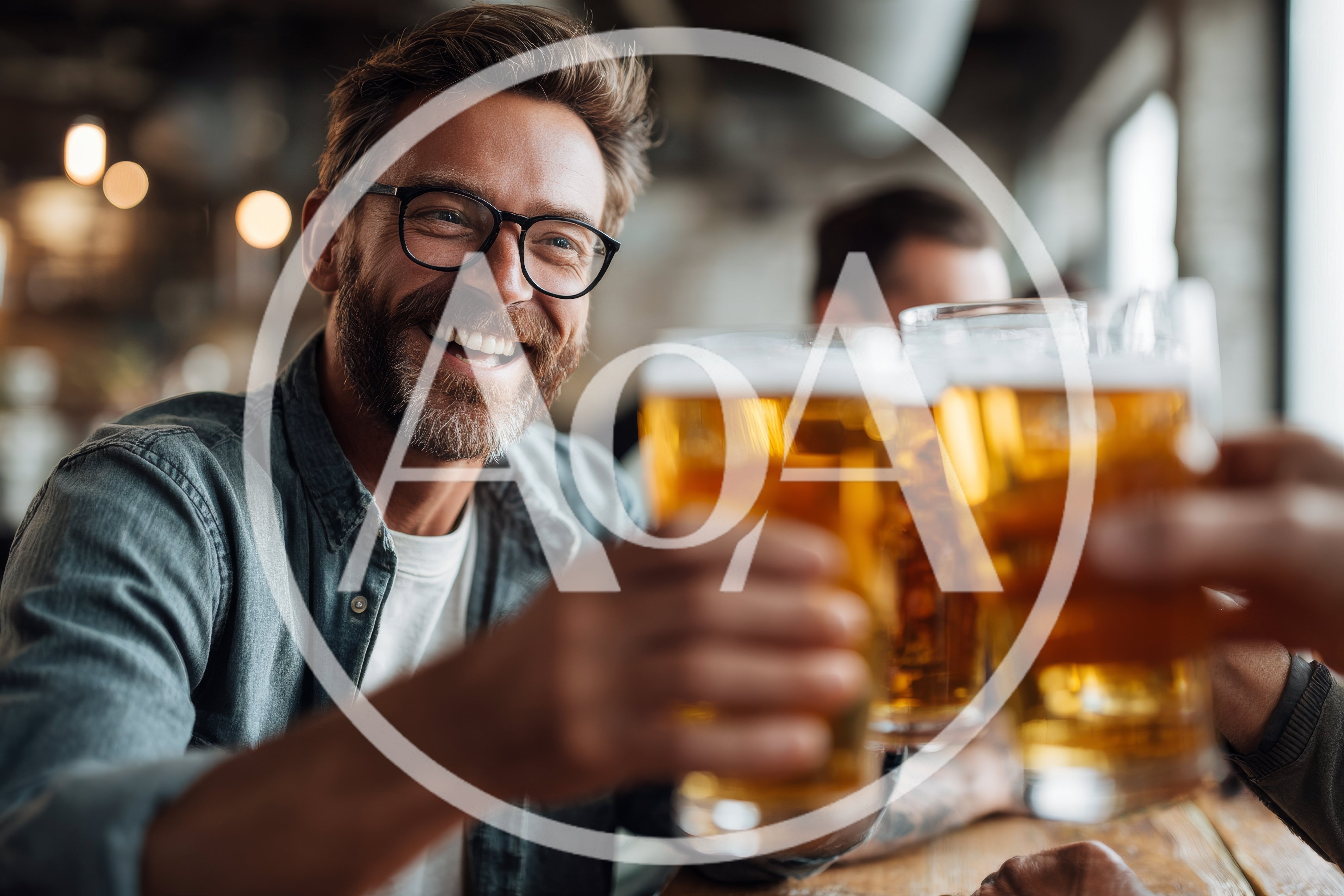 Happy Man Toasting With Beer In A Pub