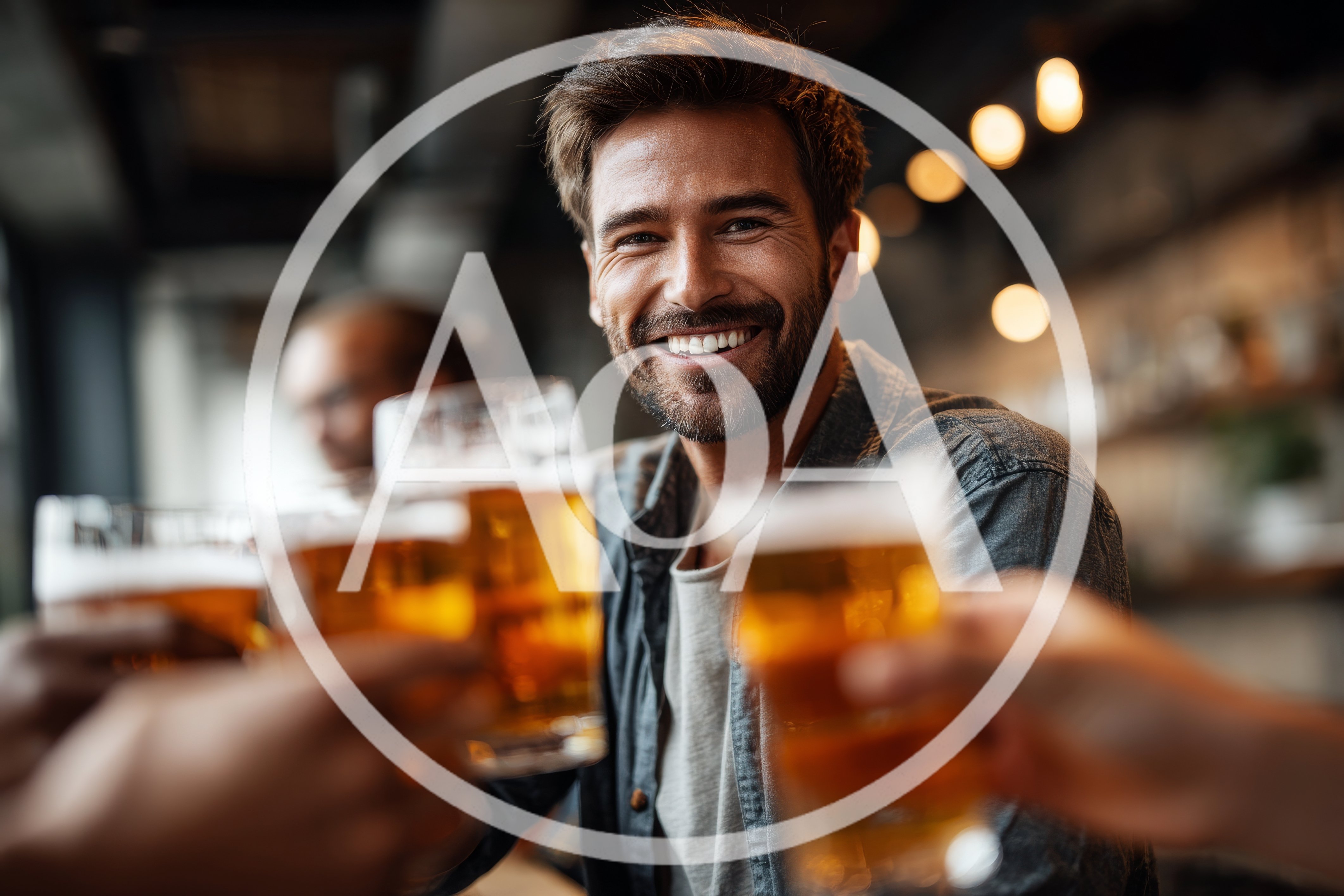 Happy Man Toasting With Beer In A Pub