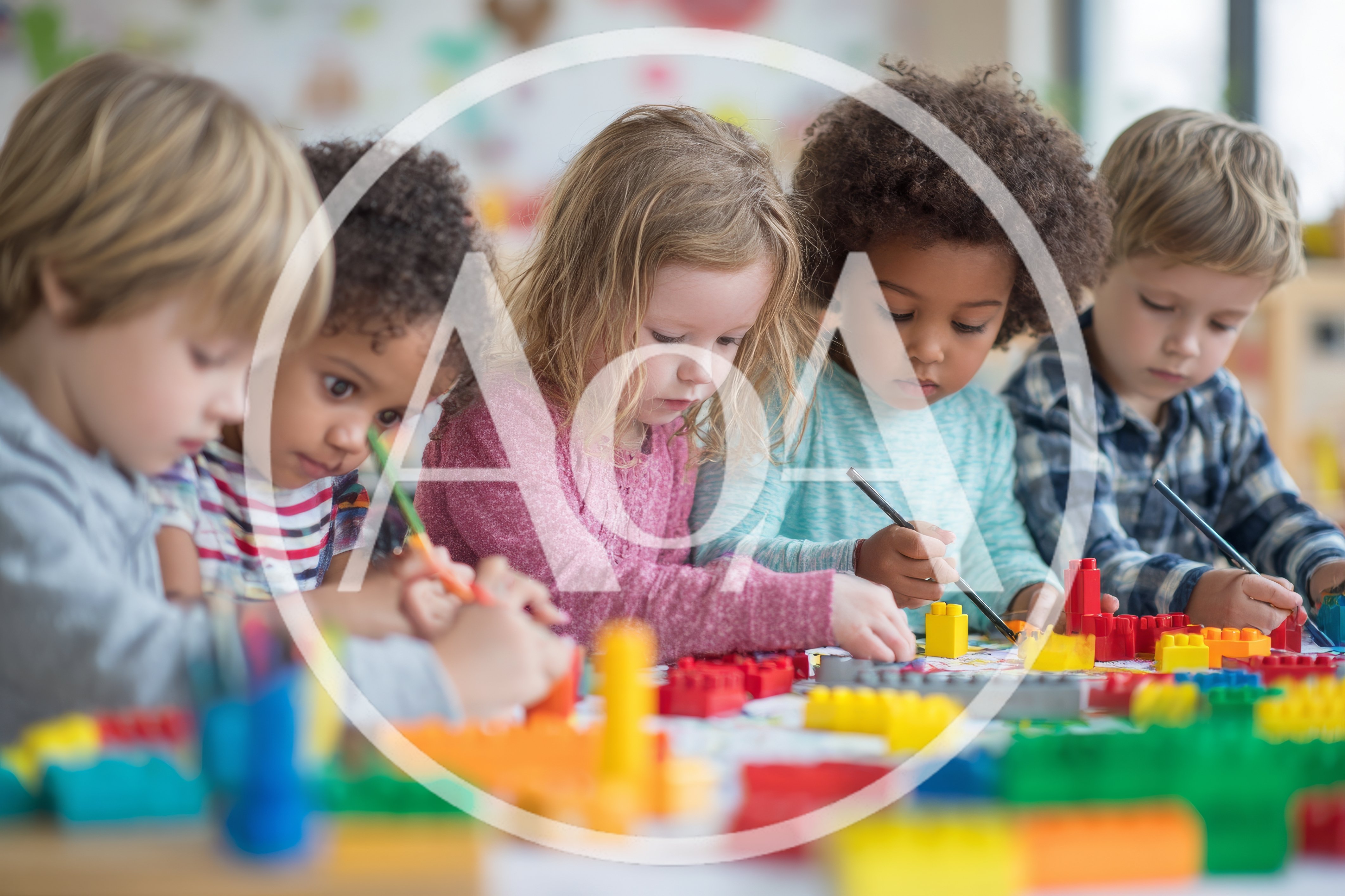 Diverse Preschool Children Drawing And Playing With Building Blocks