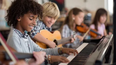 Diverse Children Playing Musical Instruments In Music Class