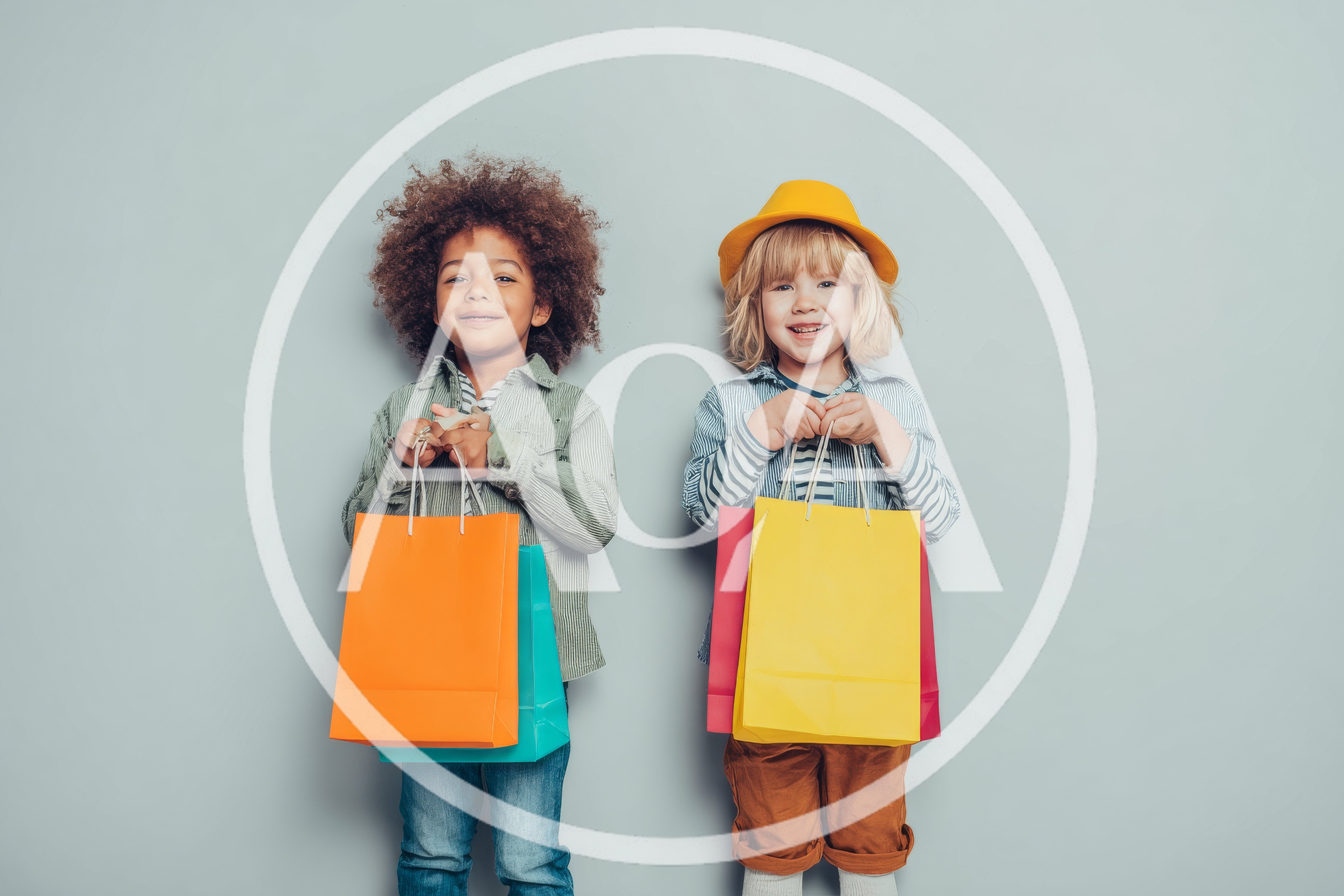 Two Happy Children Holding Colorful Shopping Bags